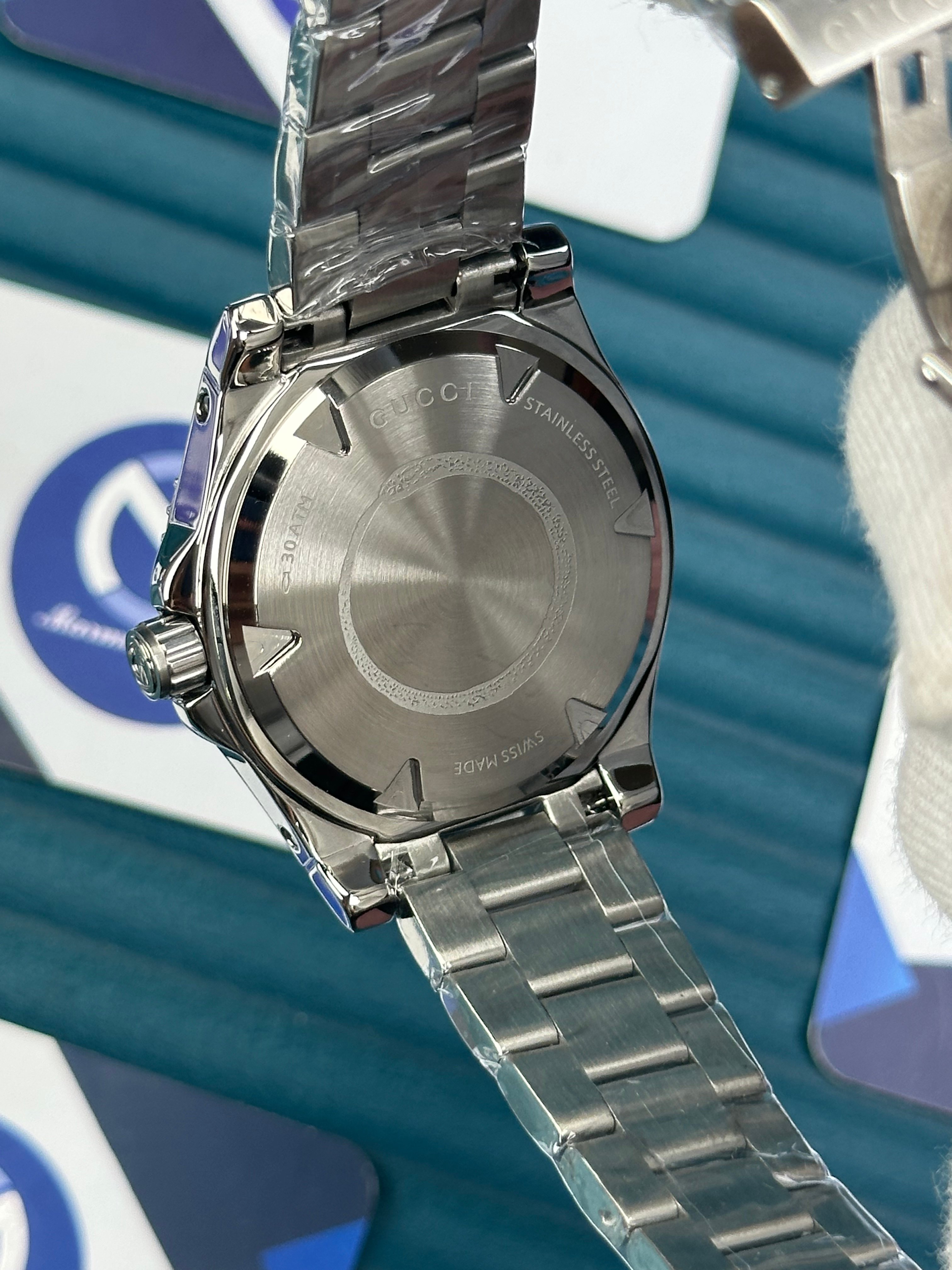 GUCCI BLACK DIAL TRIANGLE INDEX SILVER CORD