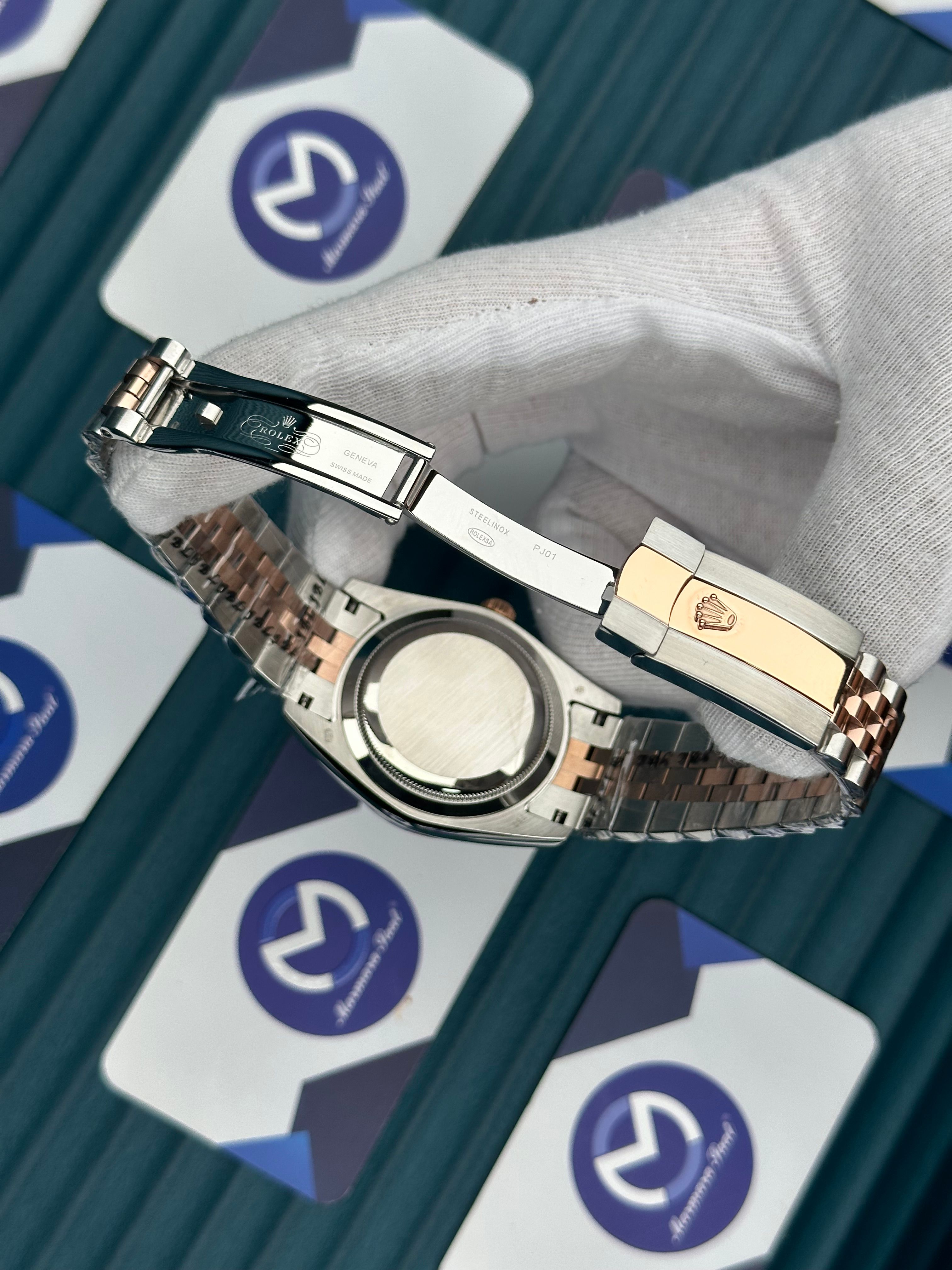 ROLEX DAY-DATE GREEN DIAL ROMA INDEX OVAL BEZEL ROSE-SILVER JUBILE