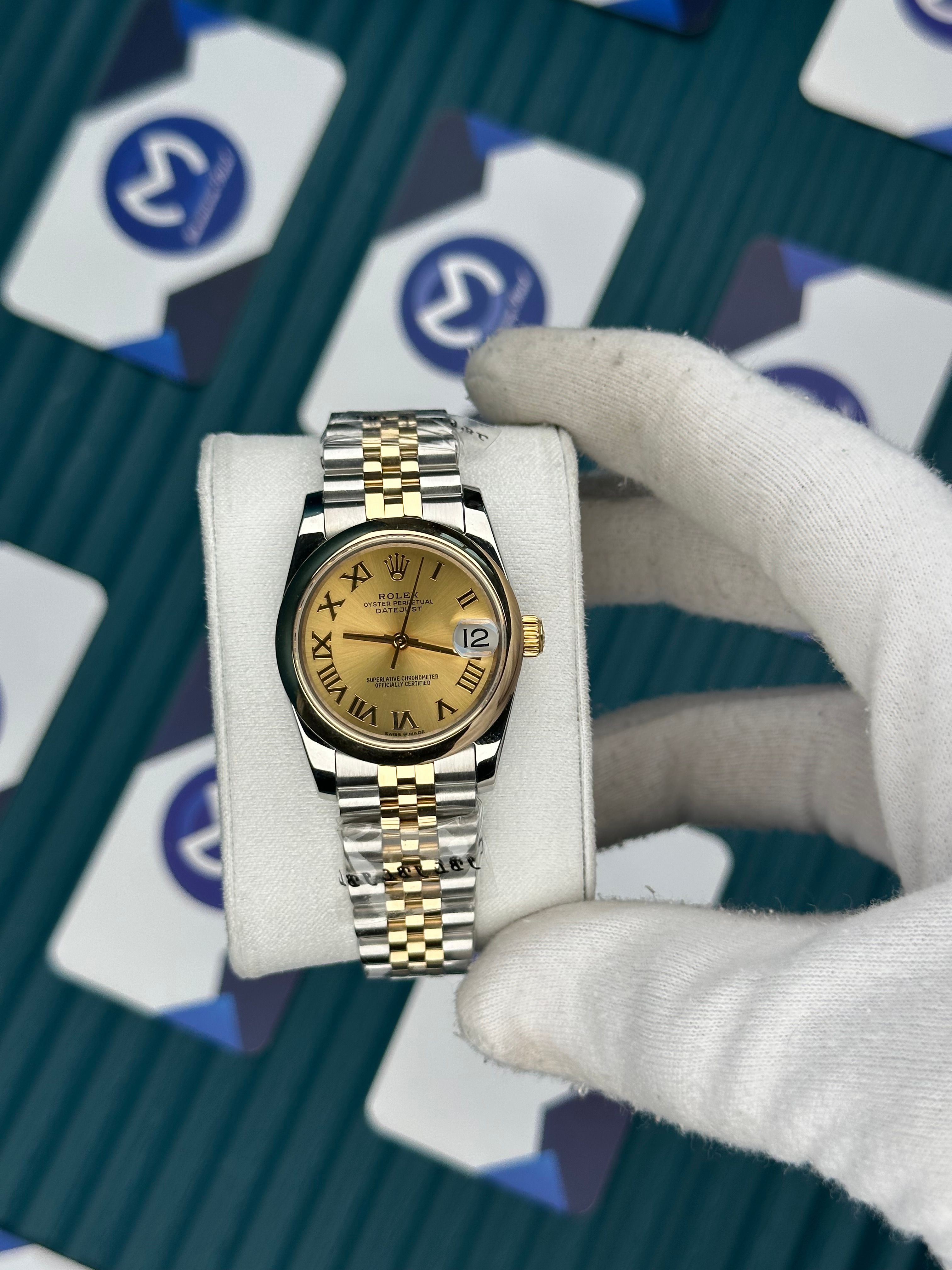 ROLEX 31 OVAL BEZEL CHAMPAGNE DIAL ROMA INDEX GOLD-SILVER JUBILEE
