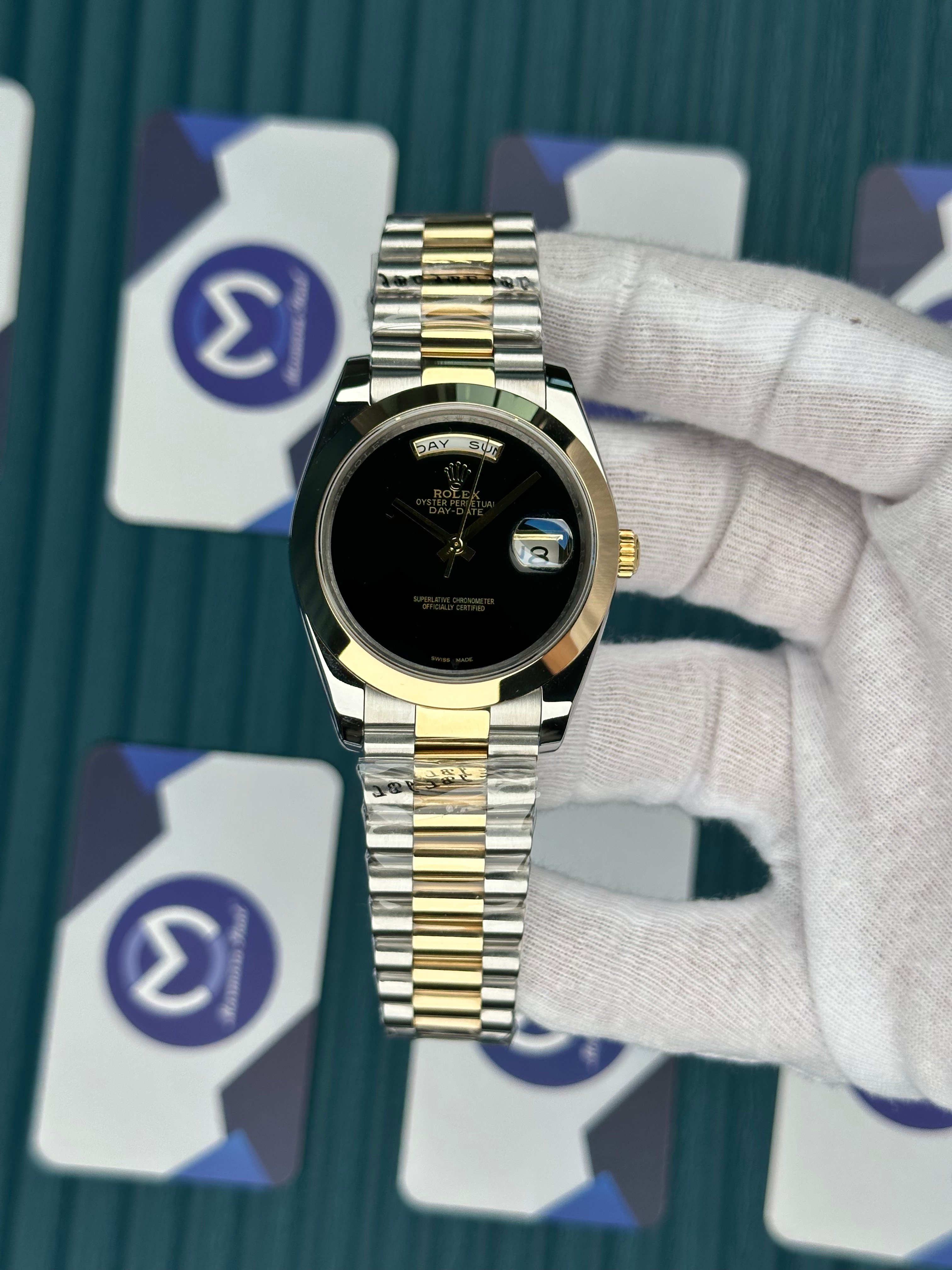ROLEX DAY-DATE BLACK DIAL OVAL BEZEL GOLD-SILVER PRESIDENT