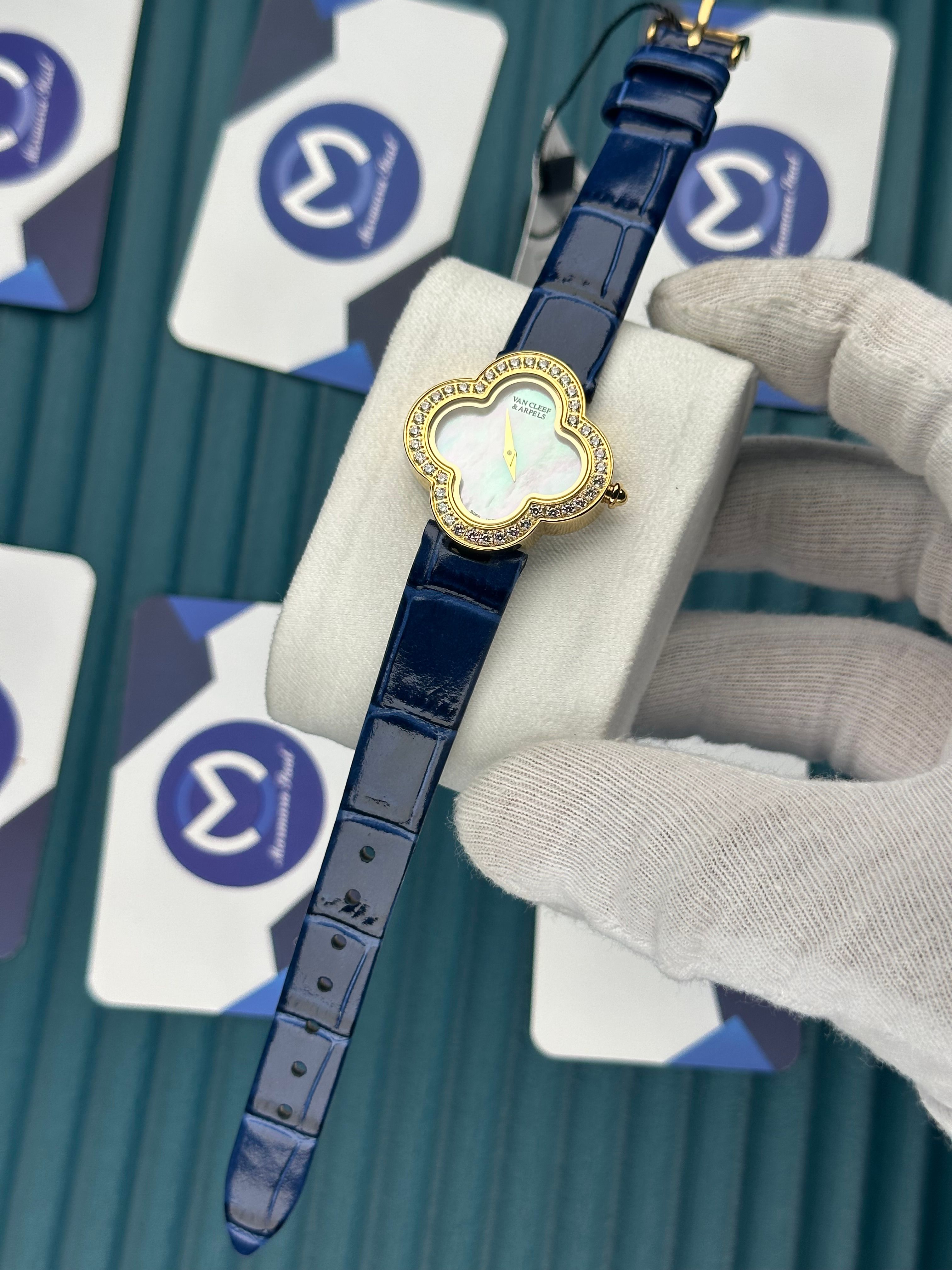 VAN CLEEF & ARPELS WHITE DIAL DIAMOND BEZEL GOLD CASE BLUE LEATHER CORD