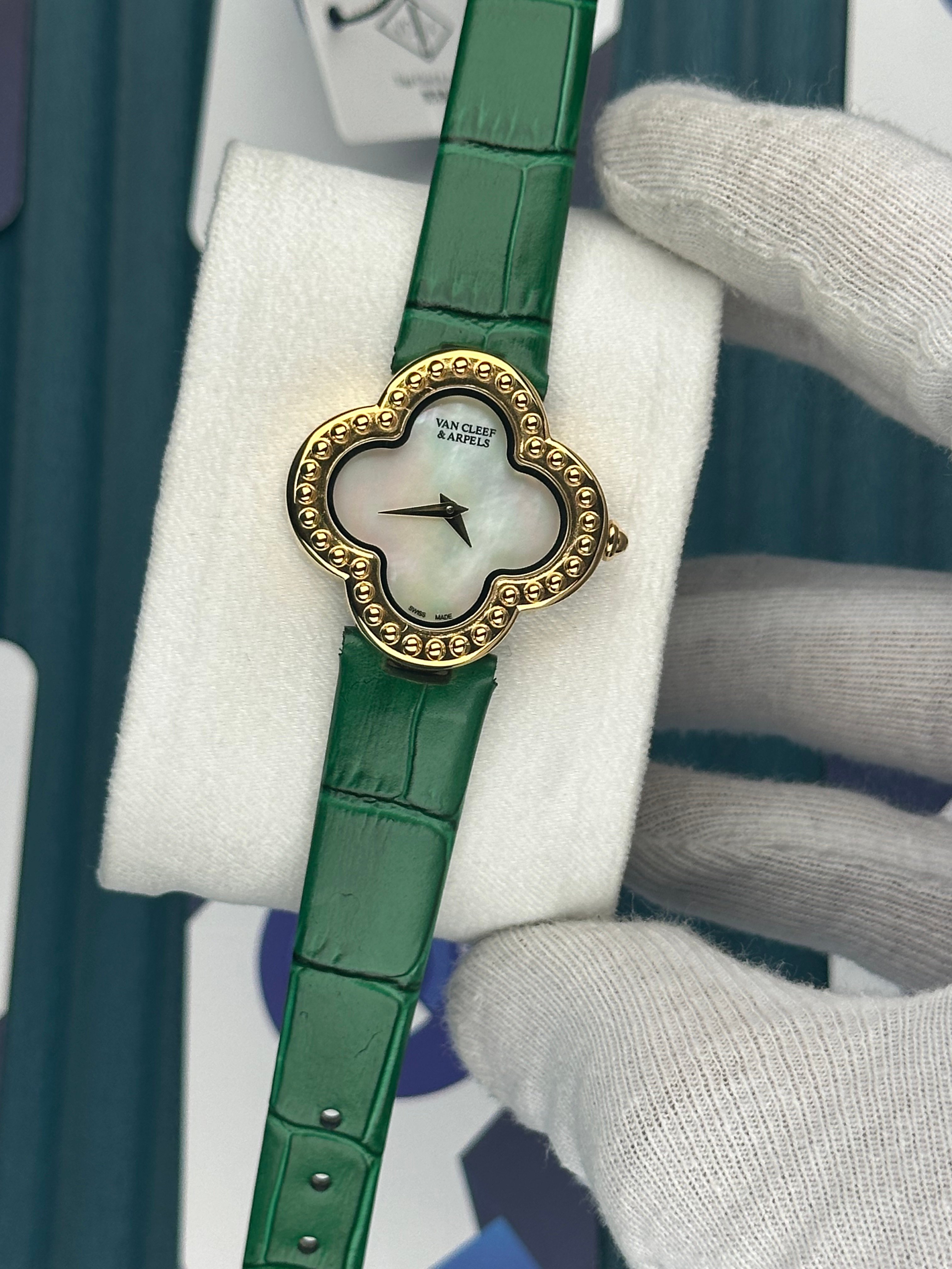 VAN CLEEF & ARPELS WHITE DIAL DIAMOND BEZEL GOLD CASE GREEN LEATHER CORD
