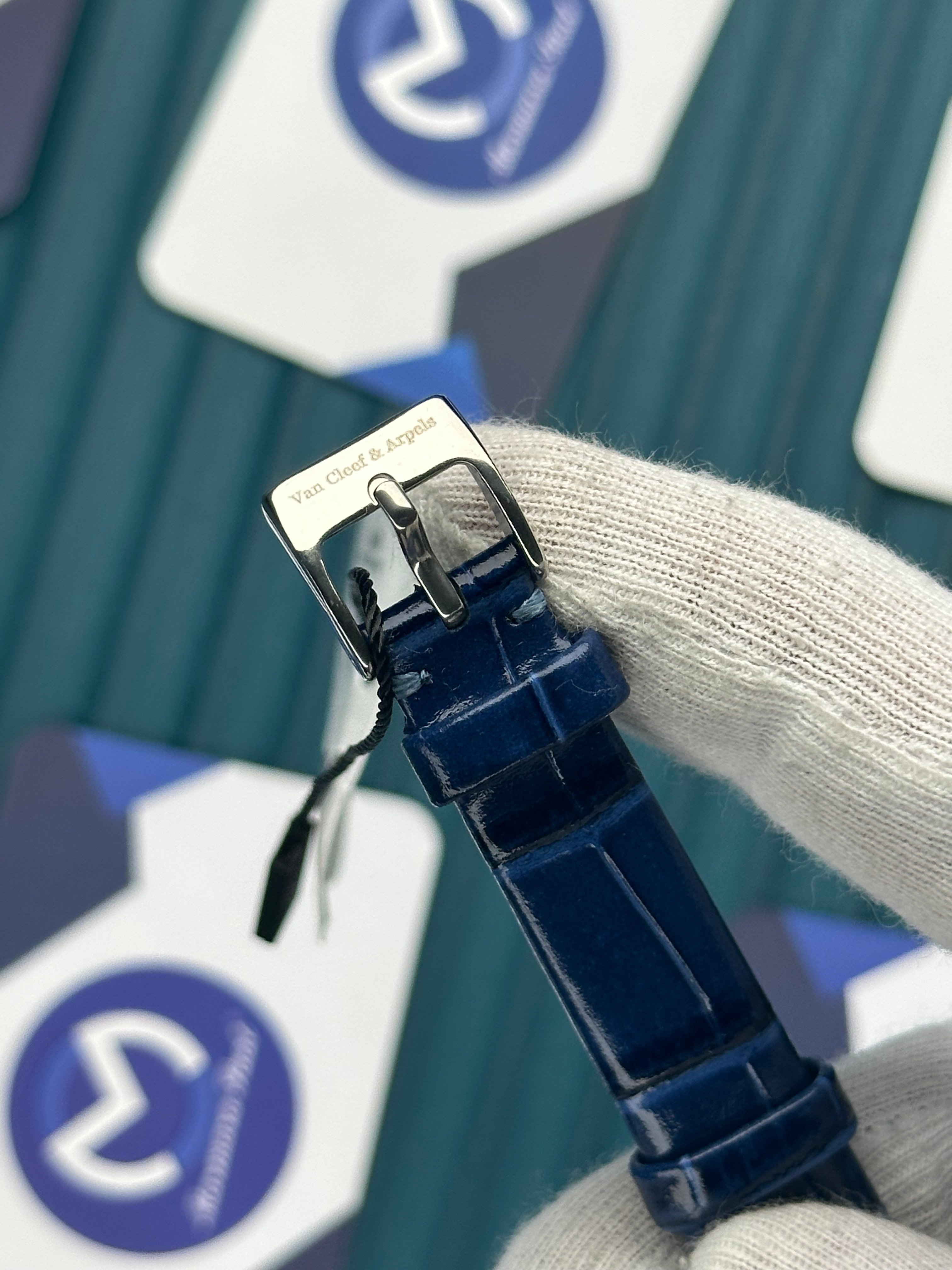 VAN CLEEF & ARPELS WHITE DIAL DIAMOND BEZEL SILVER CASE BLUE LEATHER CORD