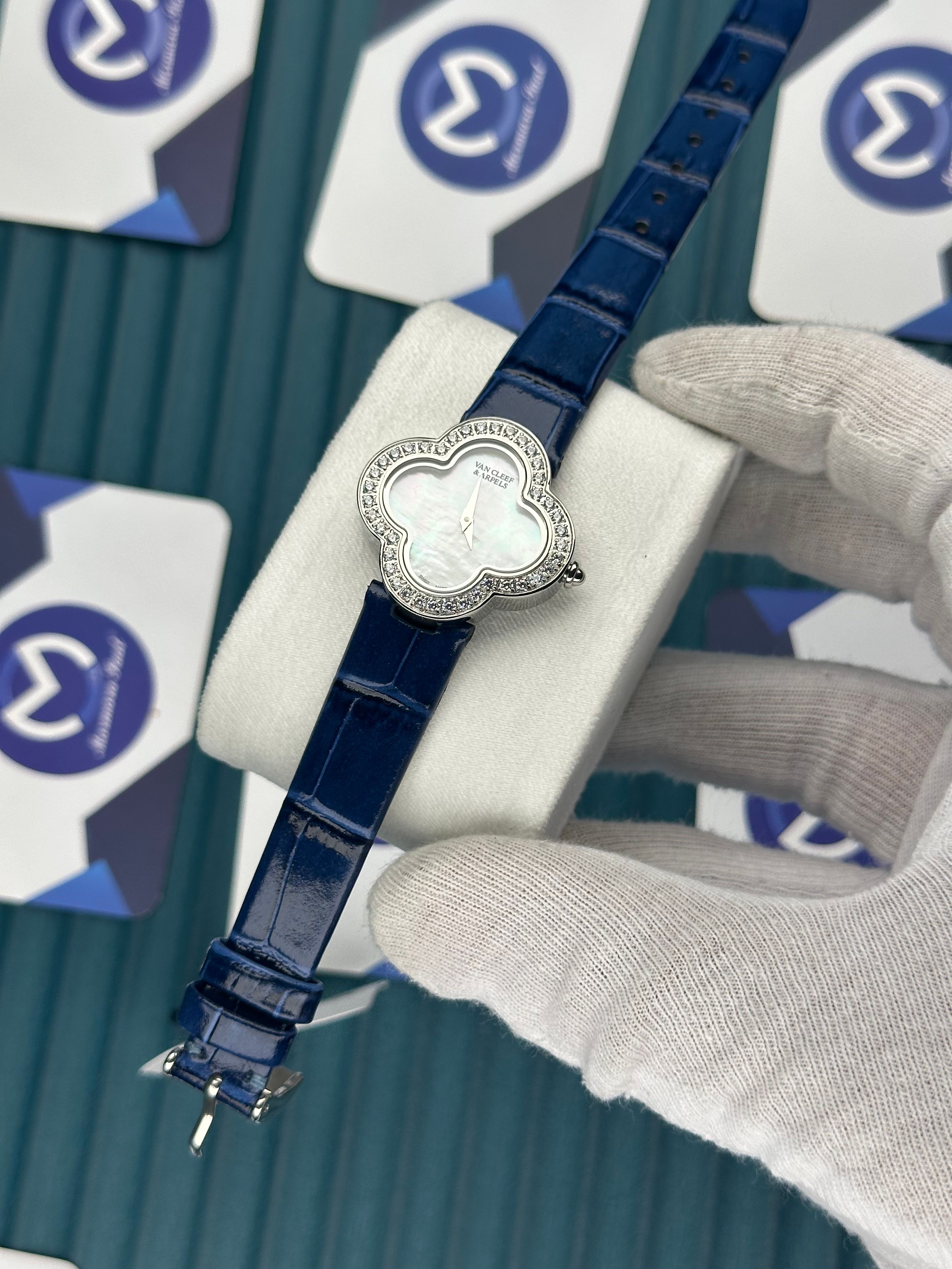 VAN CLEEF & ARPELS WHITE DIAL DIAMOND BEZEL SILVER CASE BLUE LEATHER CORD