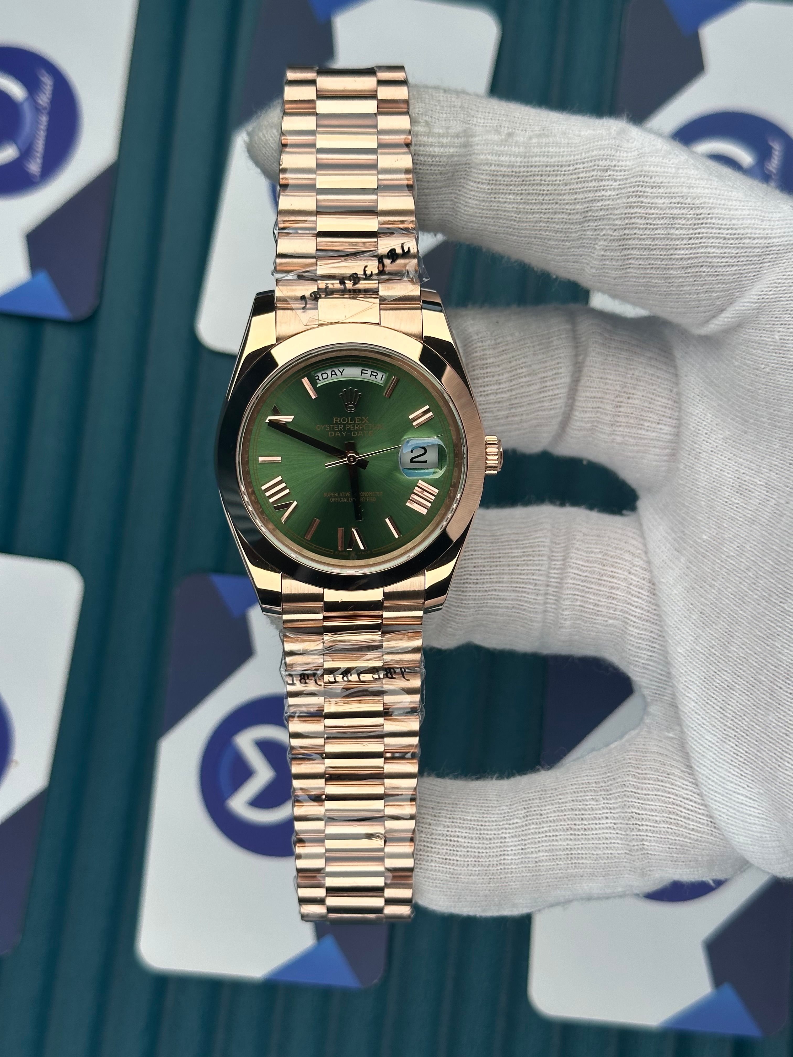 ROLEX DAY-DATE GREEN DIAL OVAL BEZEL ROSE PRESIDENT