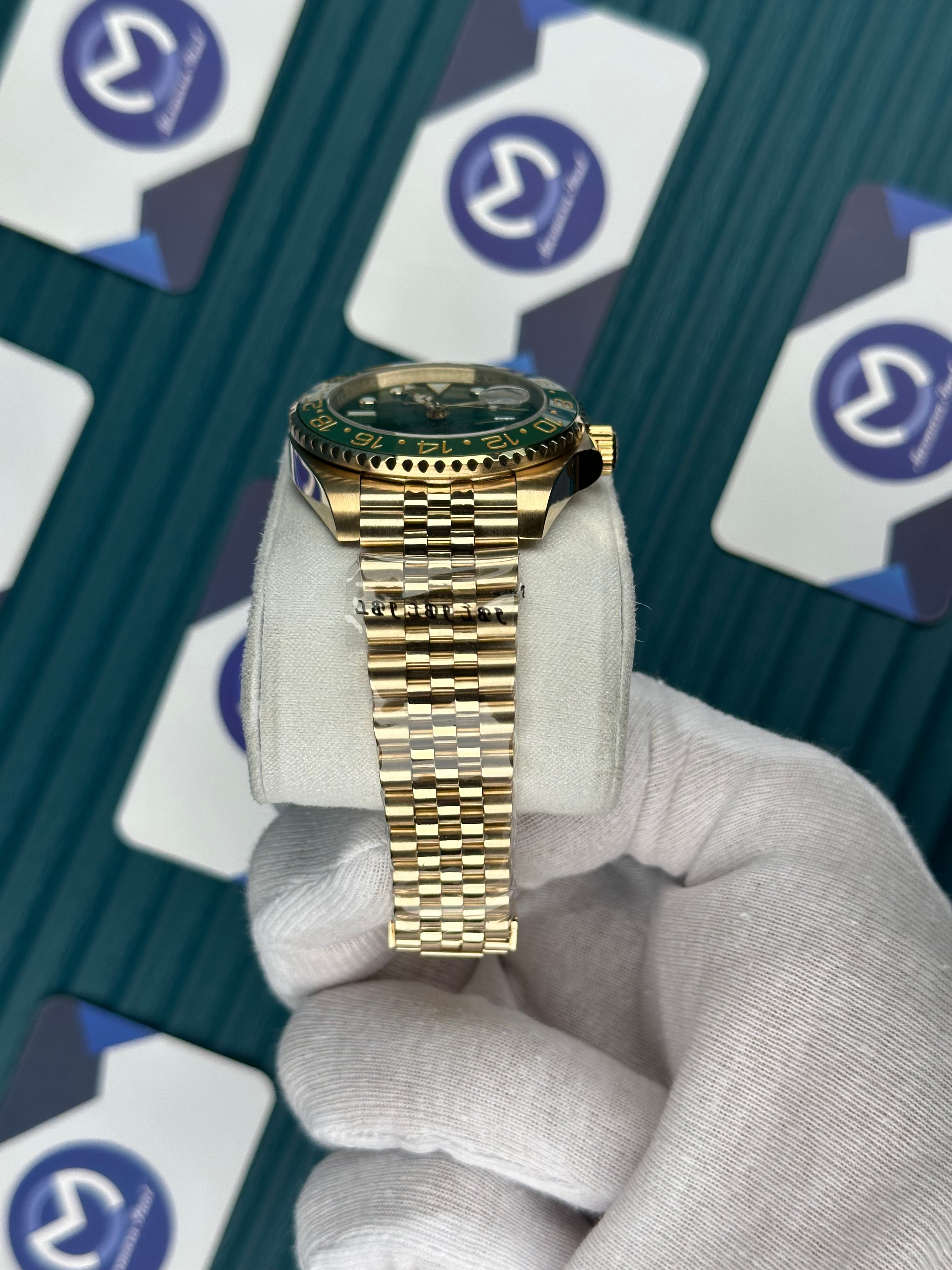 ROLEX GMT MASTER II GREEN DIAL GOLD JUBILE