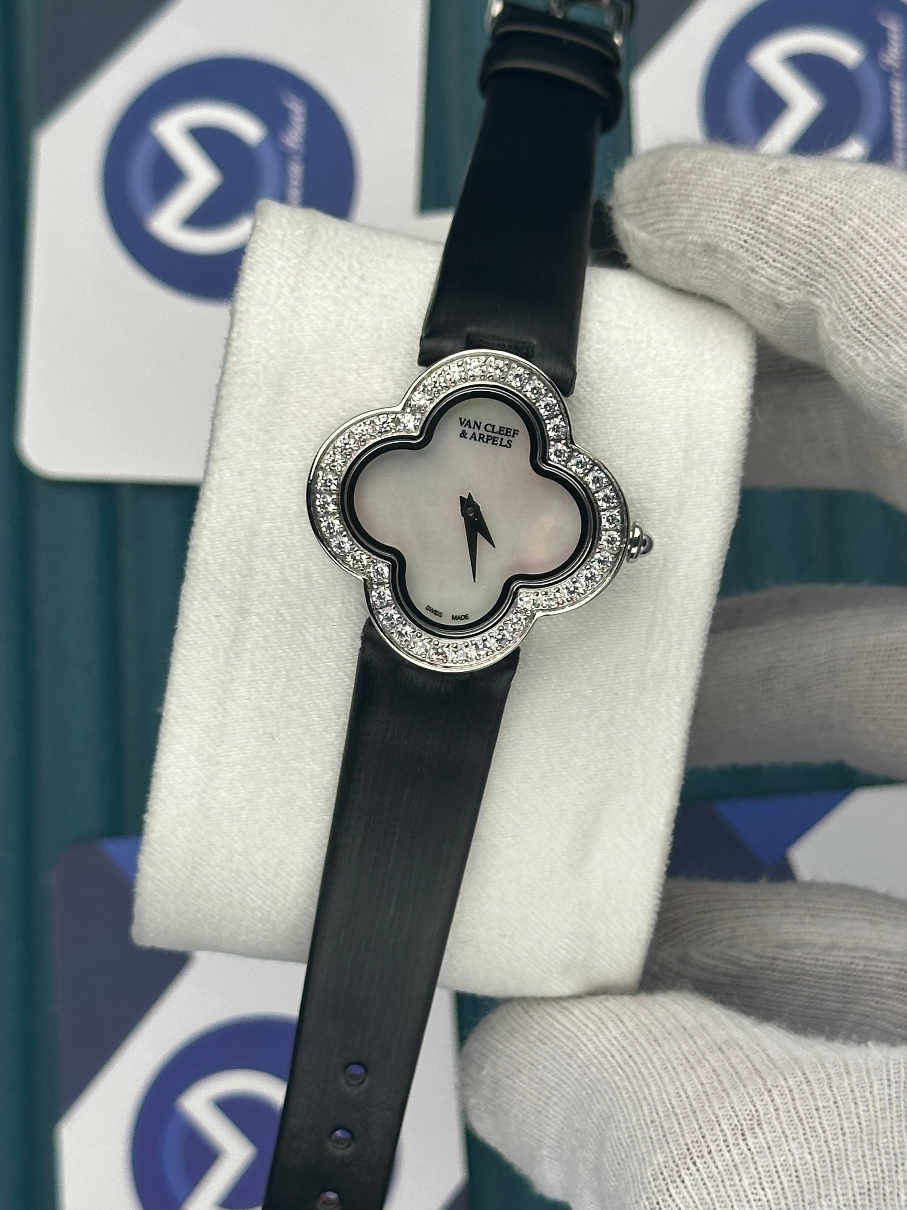 VAN CLEEF & ARPELS WHITE DIAL DIAMOND BEZEL SILVER CASE BLACK LEATHER CORD