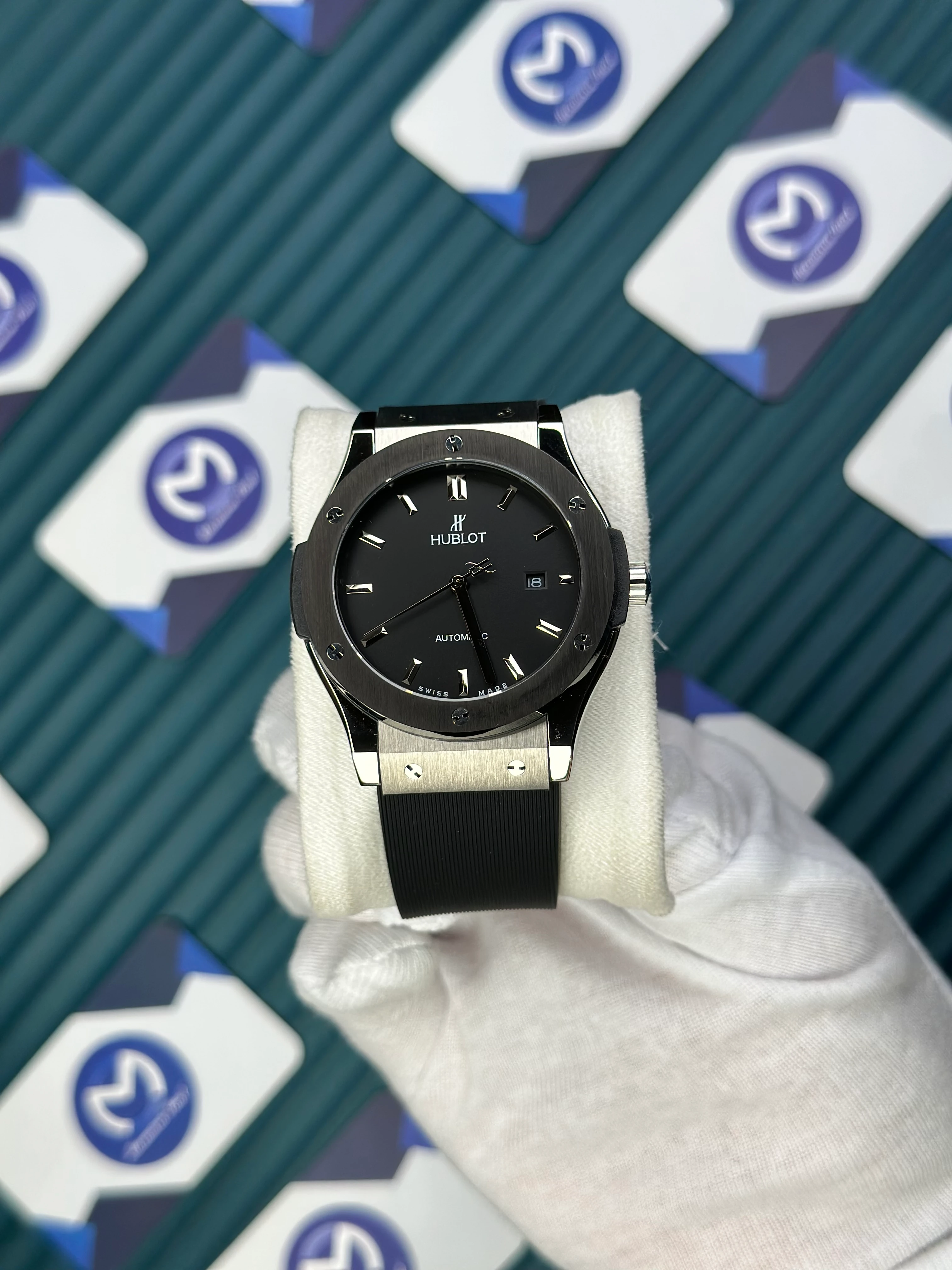 HUBLOT GENEVE AUTOMATIC VENDOME BLACK DIAL SILVER CASE BLACK BEZEL BLACK RUBBER CORD 