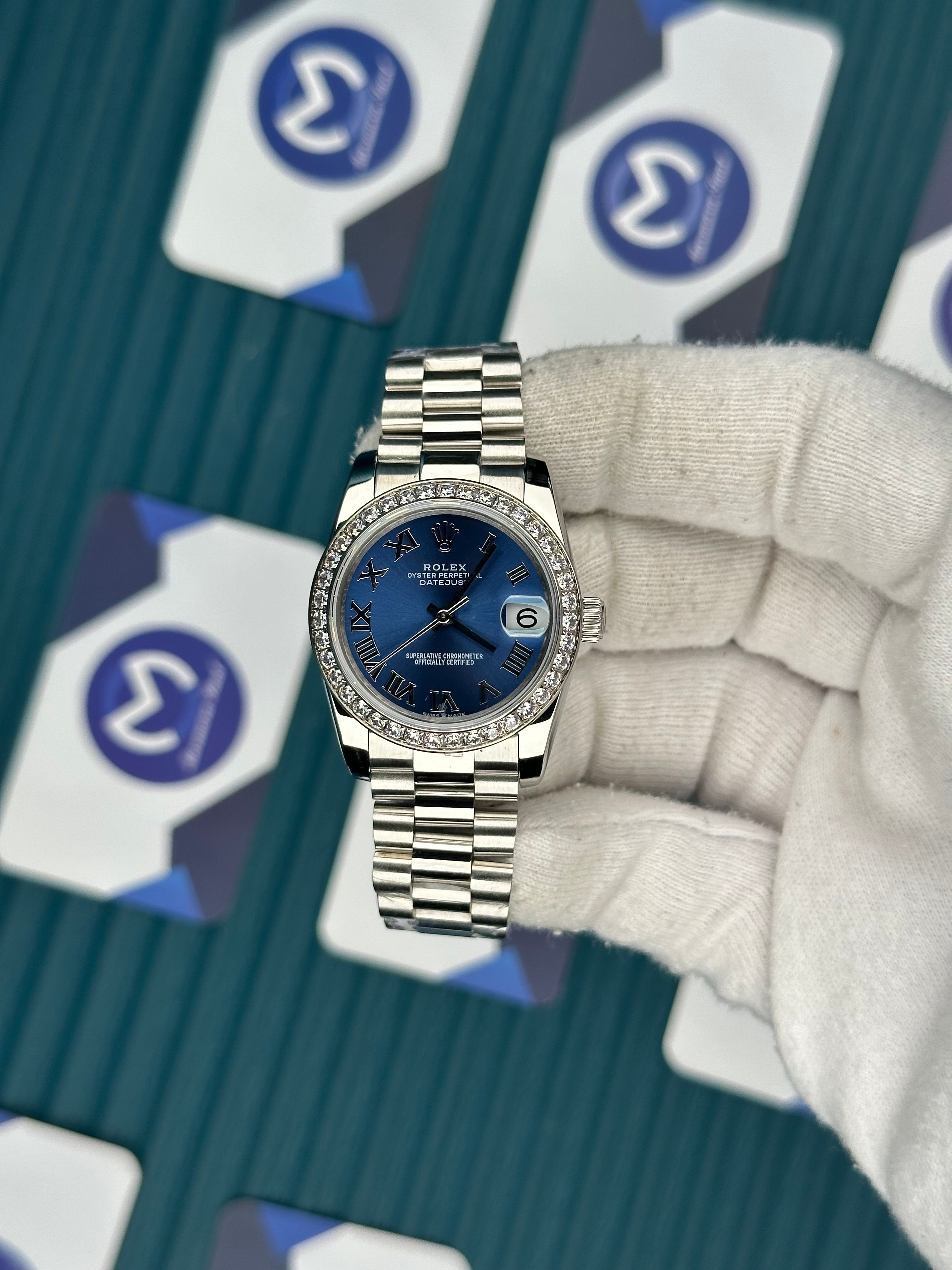 ROLEX 31 BLUE DIAL DIAMOND BEZEL SILVER PRESIDENT