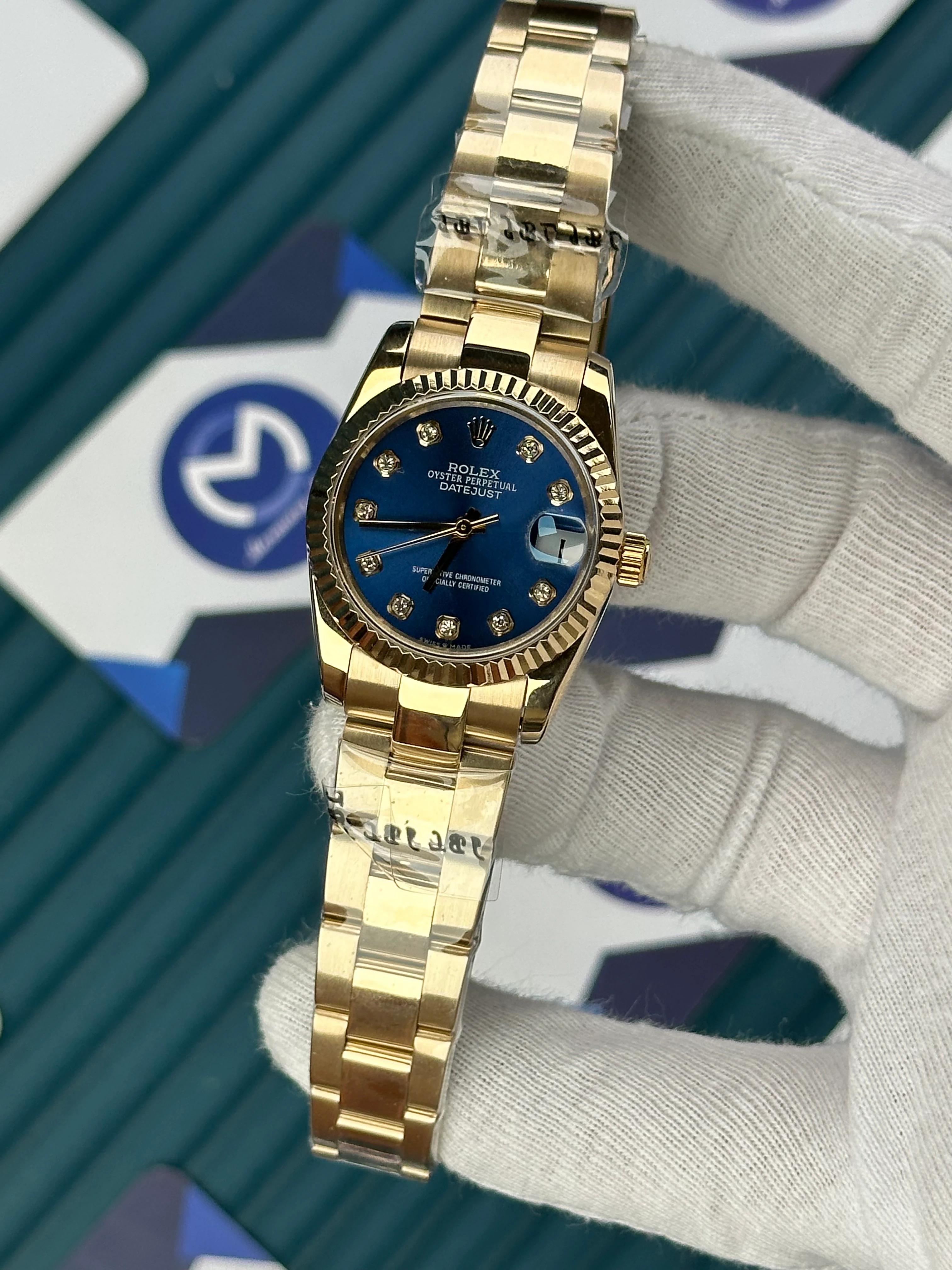 ROLEX 31 MM DATEJUST BLUE DIAL DIAMOND INDEX GOLD OYSTER 