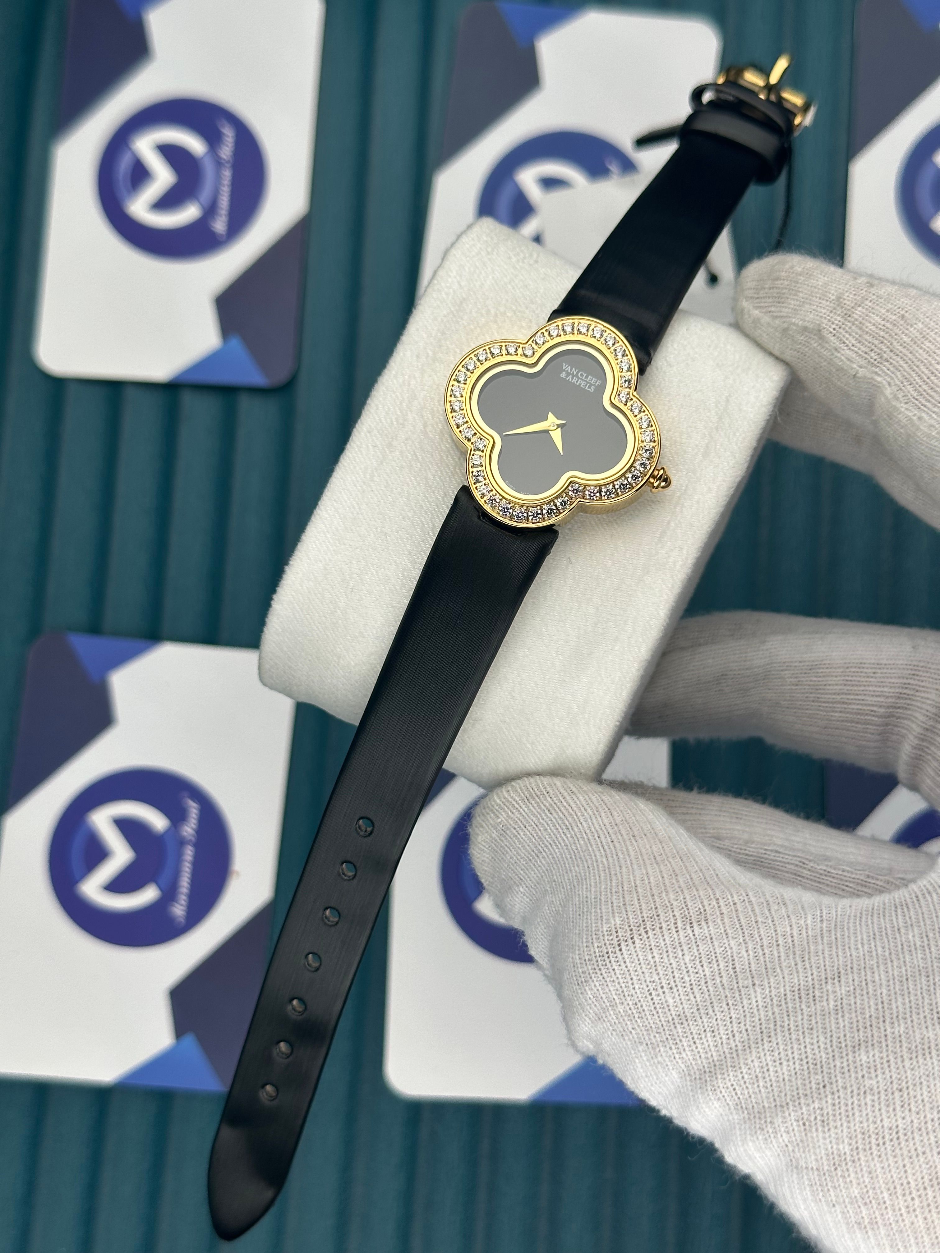 VAN CLEEF & ARPELS BLACK DIAL DIAMOND BEZEL GOLD CASE BLACK LEATHER CORD