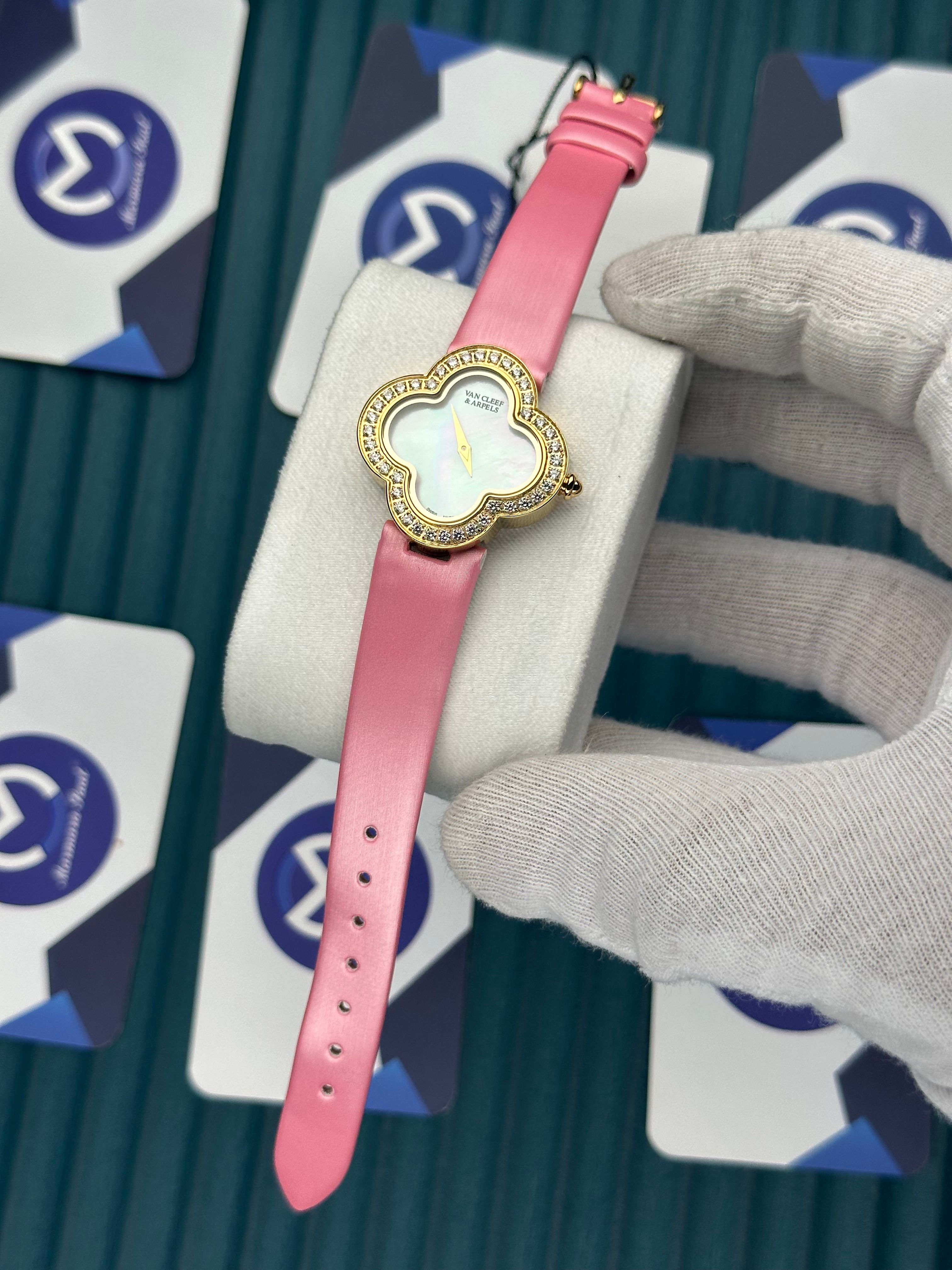 VAN CLEEF & ARPELS WHITE DIAL DIAMOND BEZEL GOLD CASE PINK LEATHER CORD