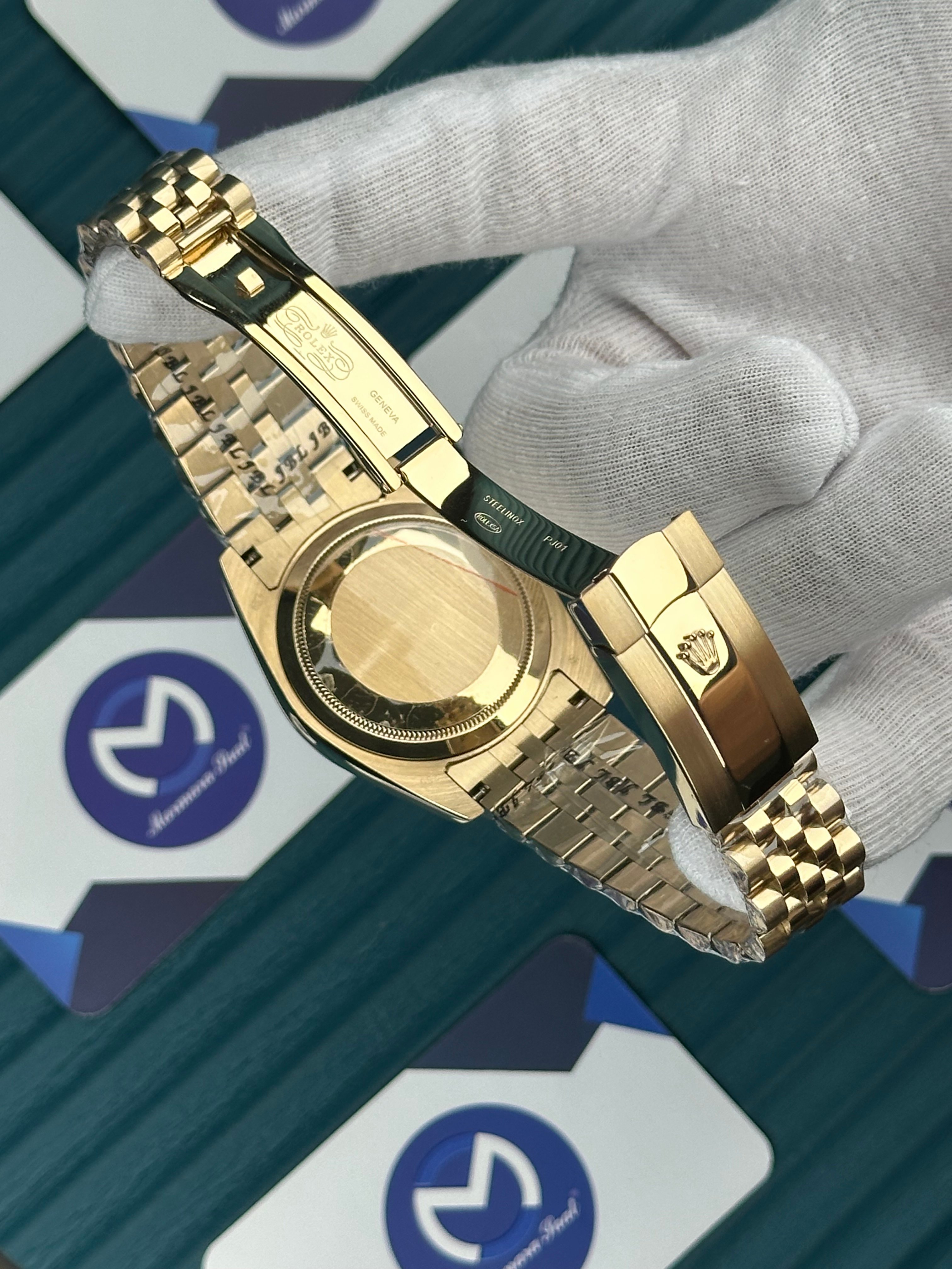 ROLEX GMT MASTER II GREEN DIAL GOLD JUBILE