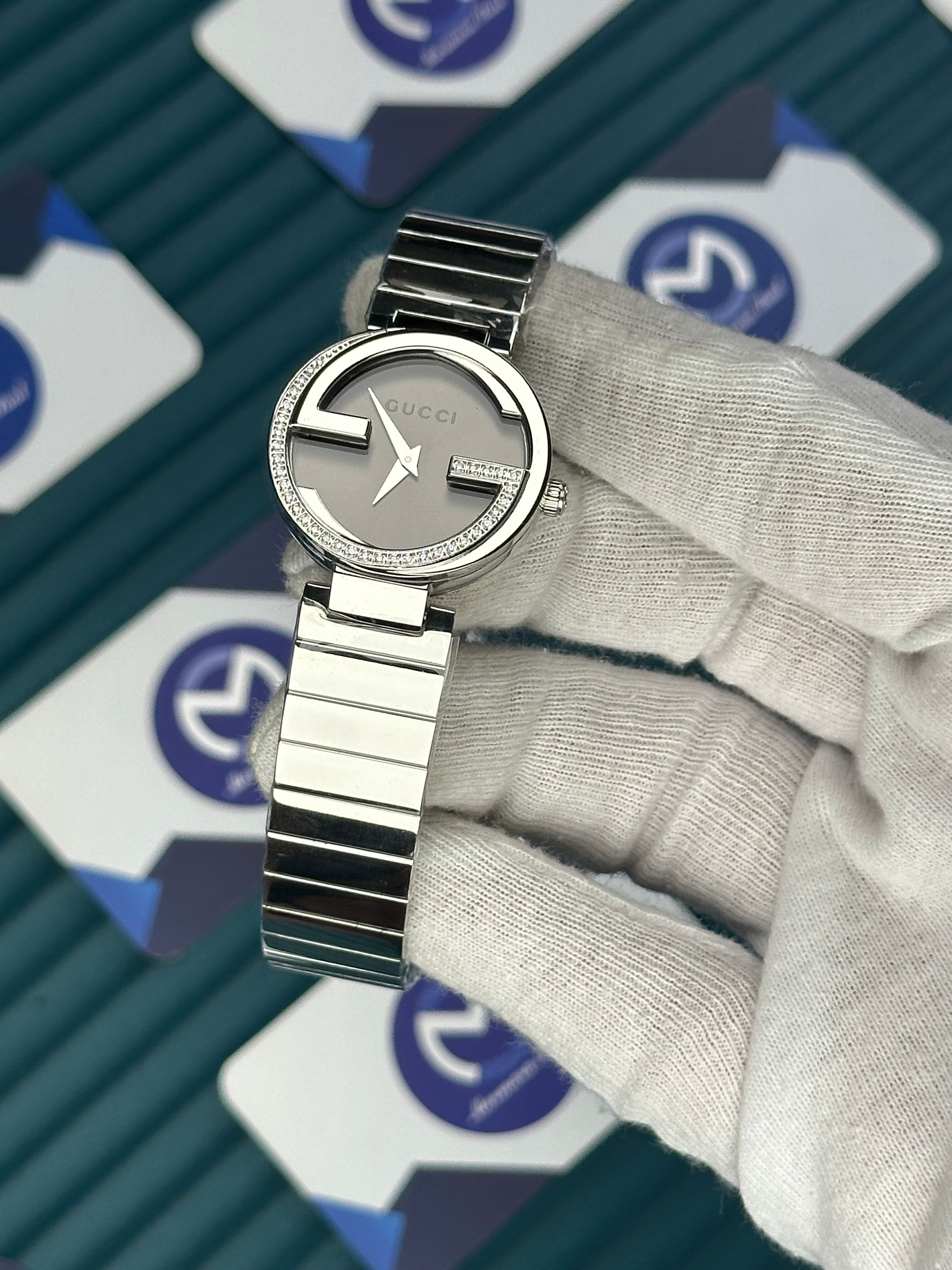 GUCCI WOMAN GREY DIAL G CASE DIAMOND DIAL SILVER CORD