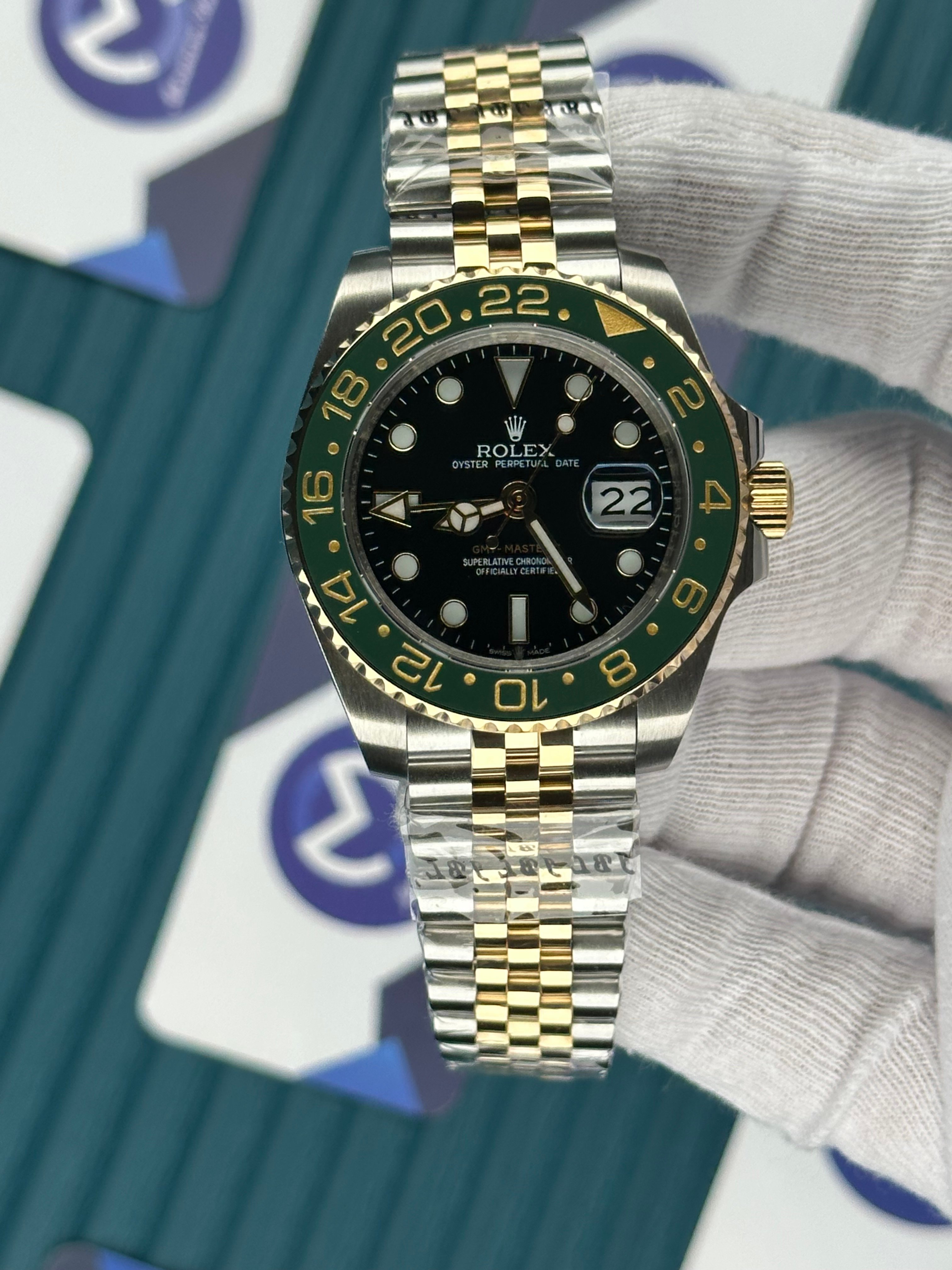 ROLEX GMT MASTER II BLACK DIAL GREEN BEZEL GOLD-SILVER JUBILE