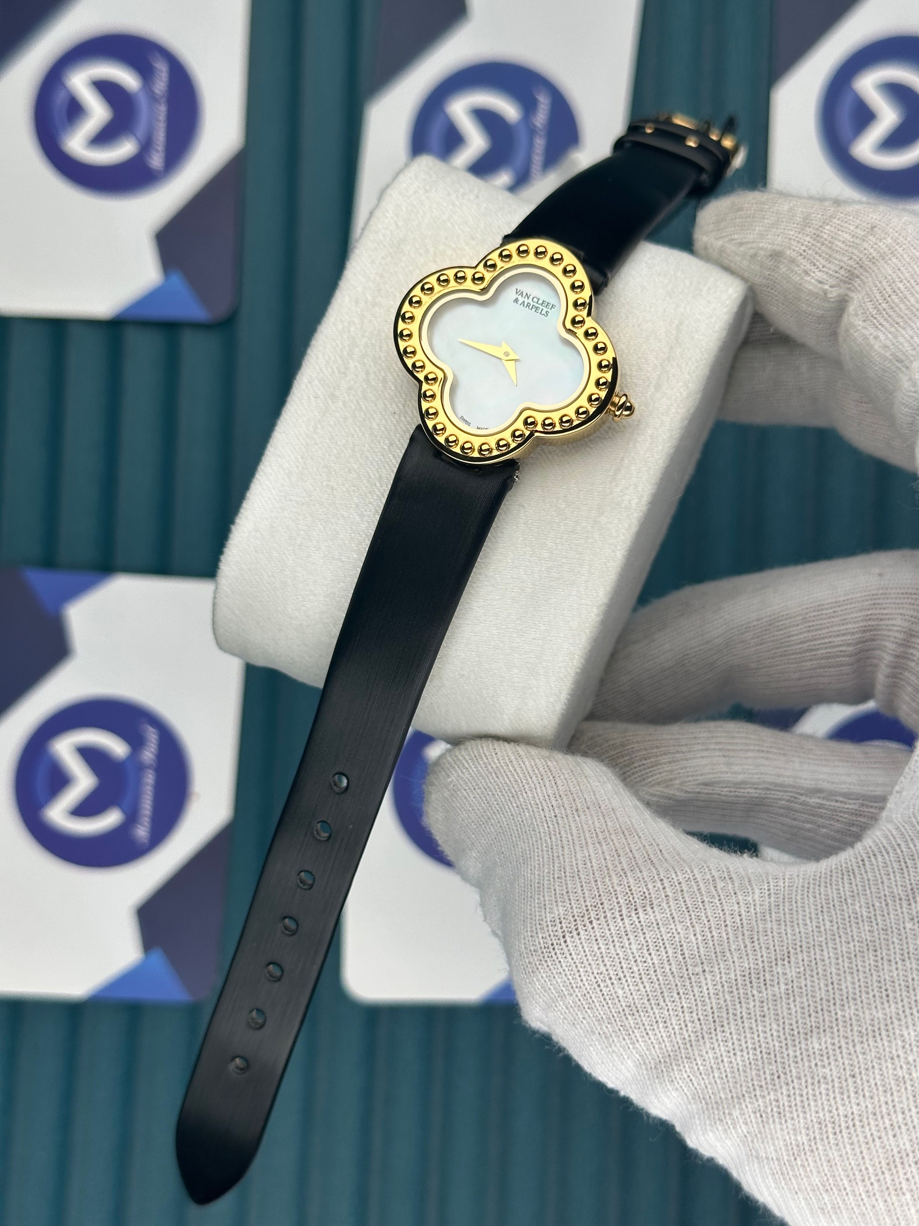 VAN CLEEF & ARPELS WHITE DIAL GOLD CASE BLACK LEATHER CORD