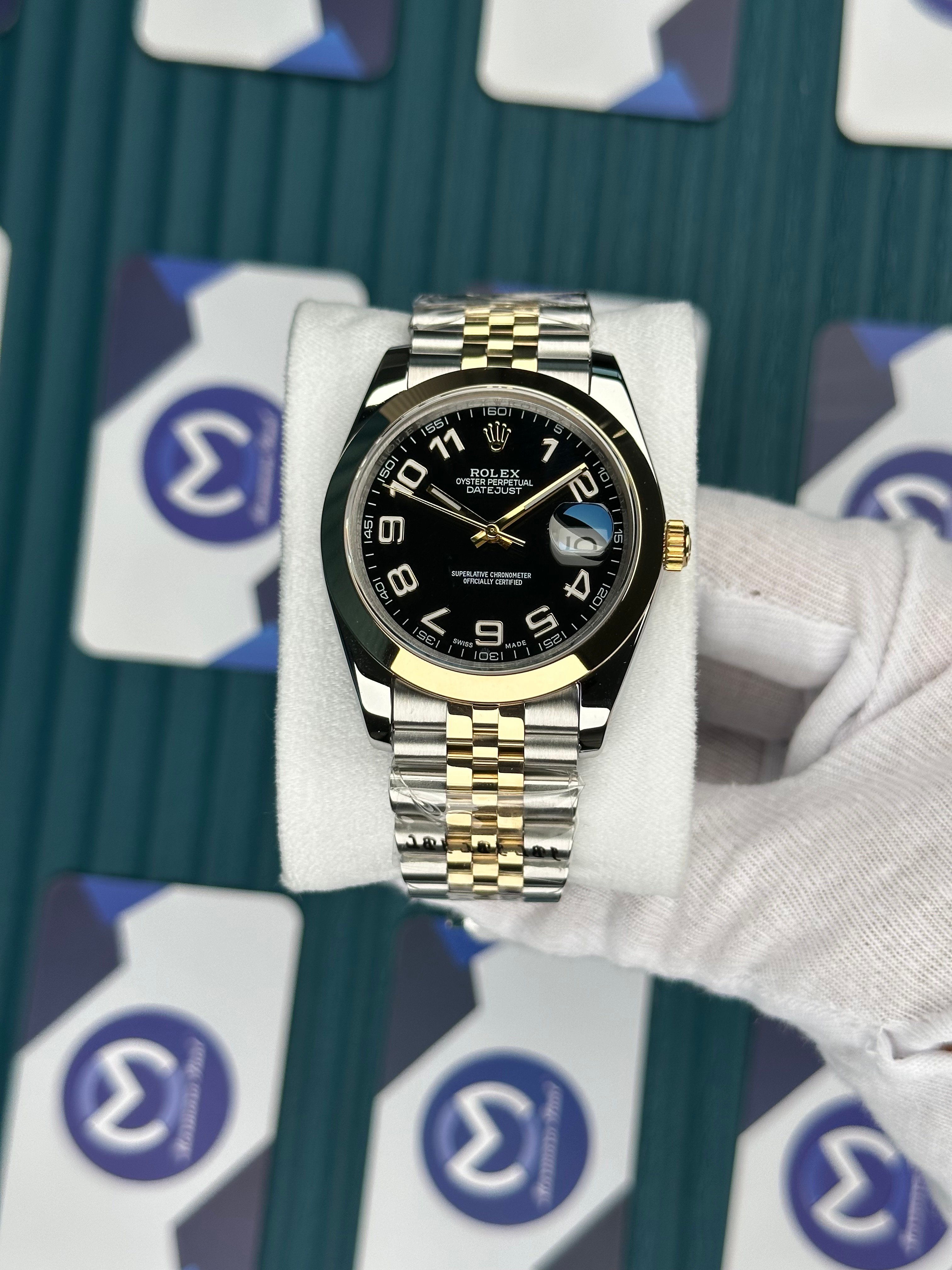 ROLEX DAY-DATE OVAL BEZEL BLACK DIAL LATIN INDEX GOLD-SILVER JUBILE