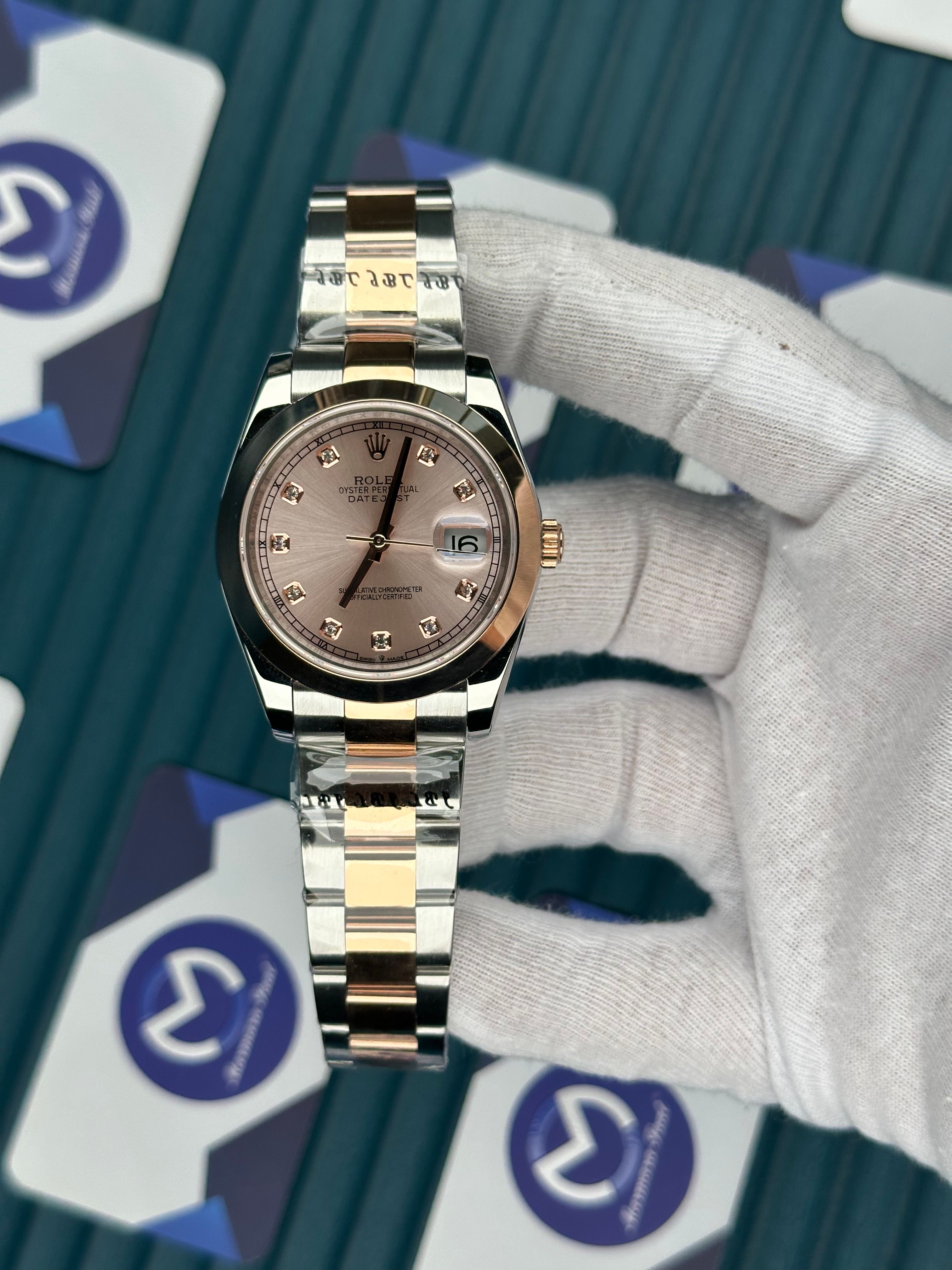 ROLEX DATEJUST CHAMPAGNE DIAL OVAL BEZEL ROSE-SILVER OYSTER