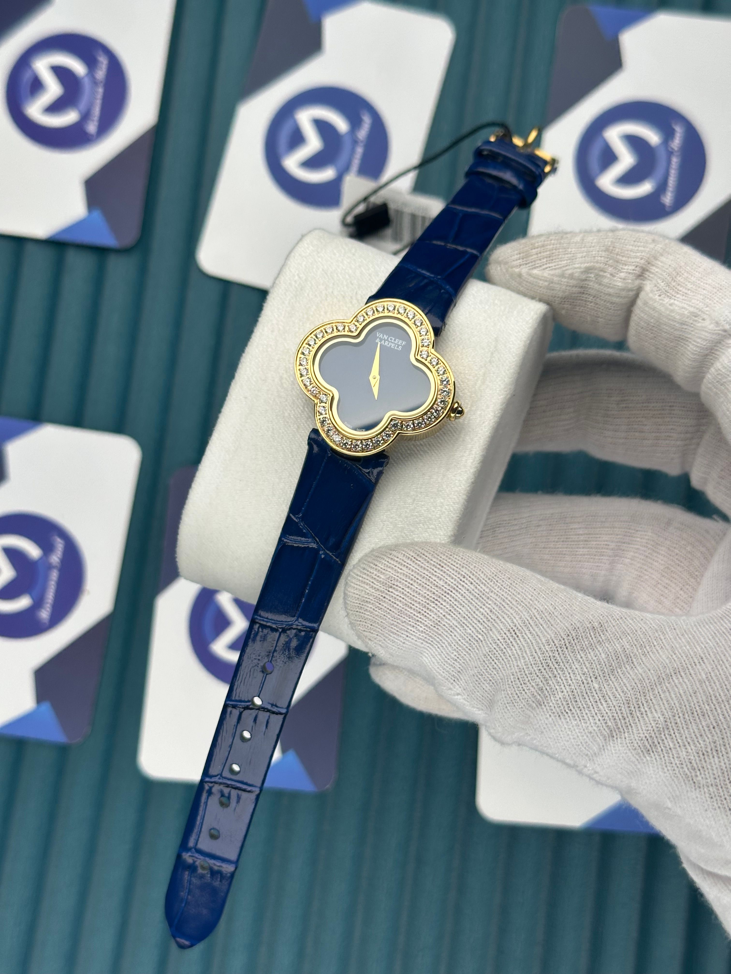 VAN CLEEF & ARPELS BLUE DIAL DIAMOND BEZEL GOLD CASE BLUE LEATHER CORD