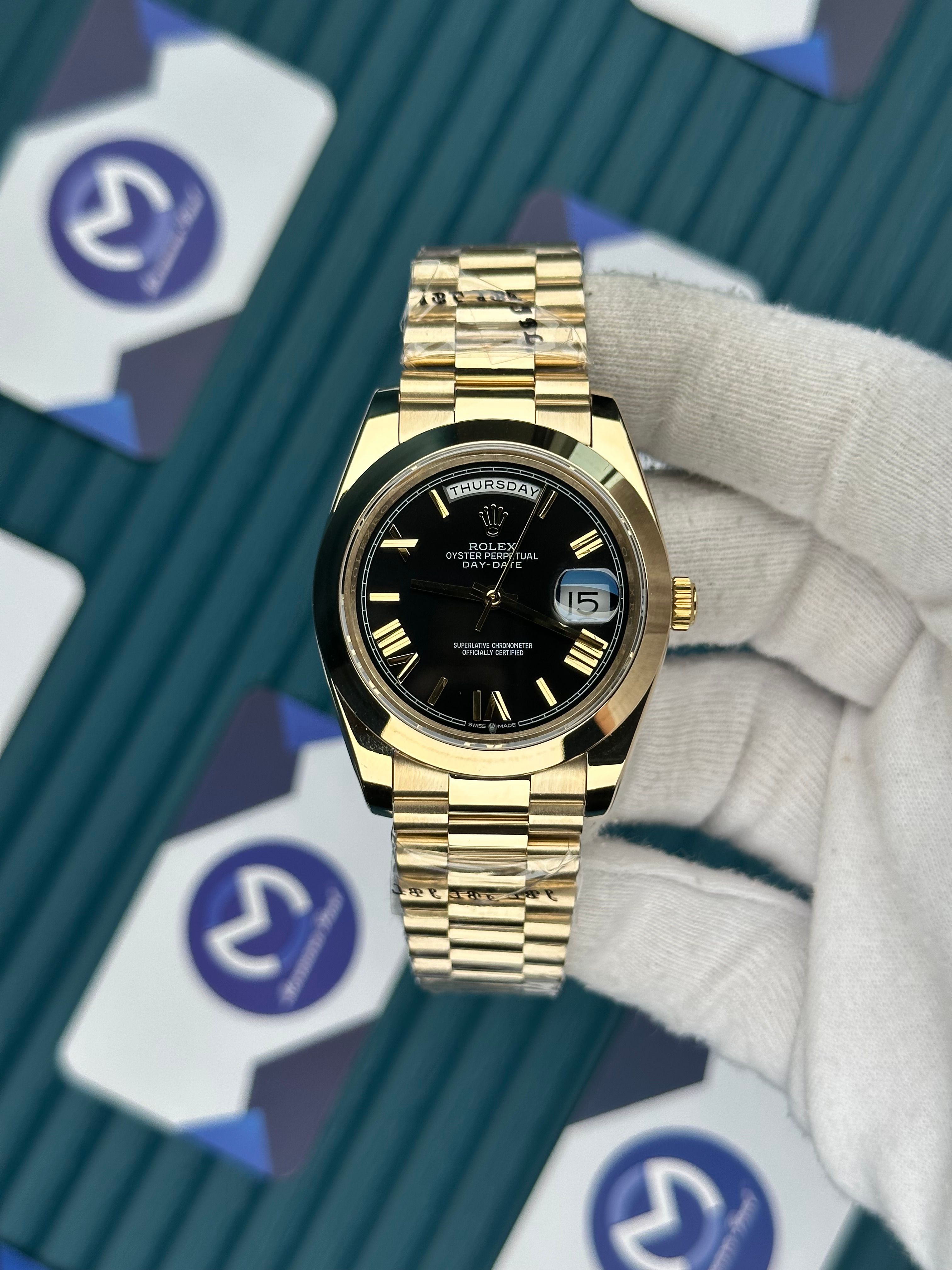 ROLEX DAY-DATE BLACK OVAL BEZEL ROMA INDEX GOLD PRESIDENT