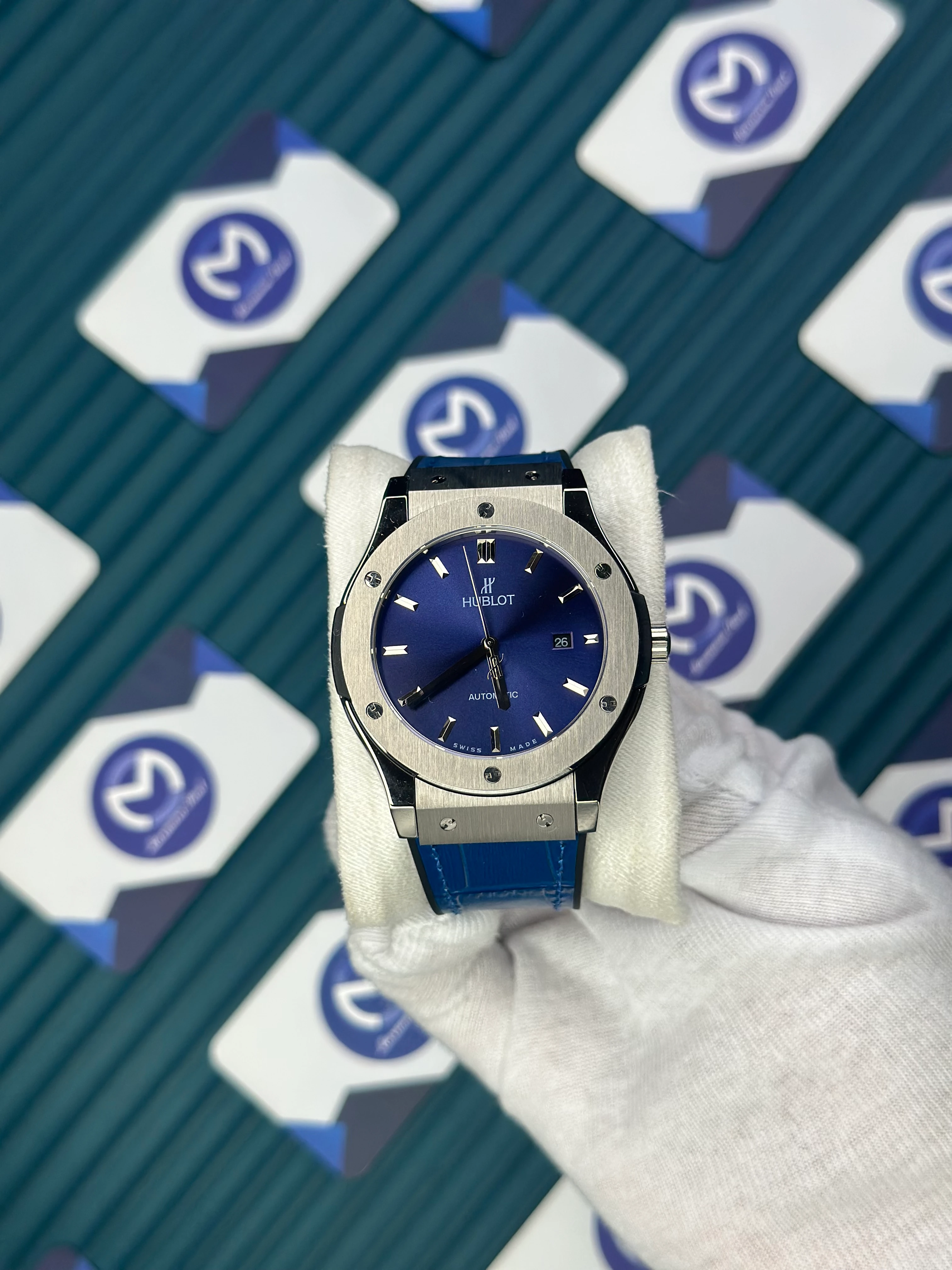 HUBLOT GENEVE AUTOMATIC VENDOME BLUE DIAL SILVER CASE BLUE LEATHER CORD 