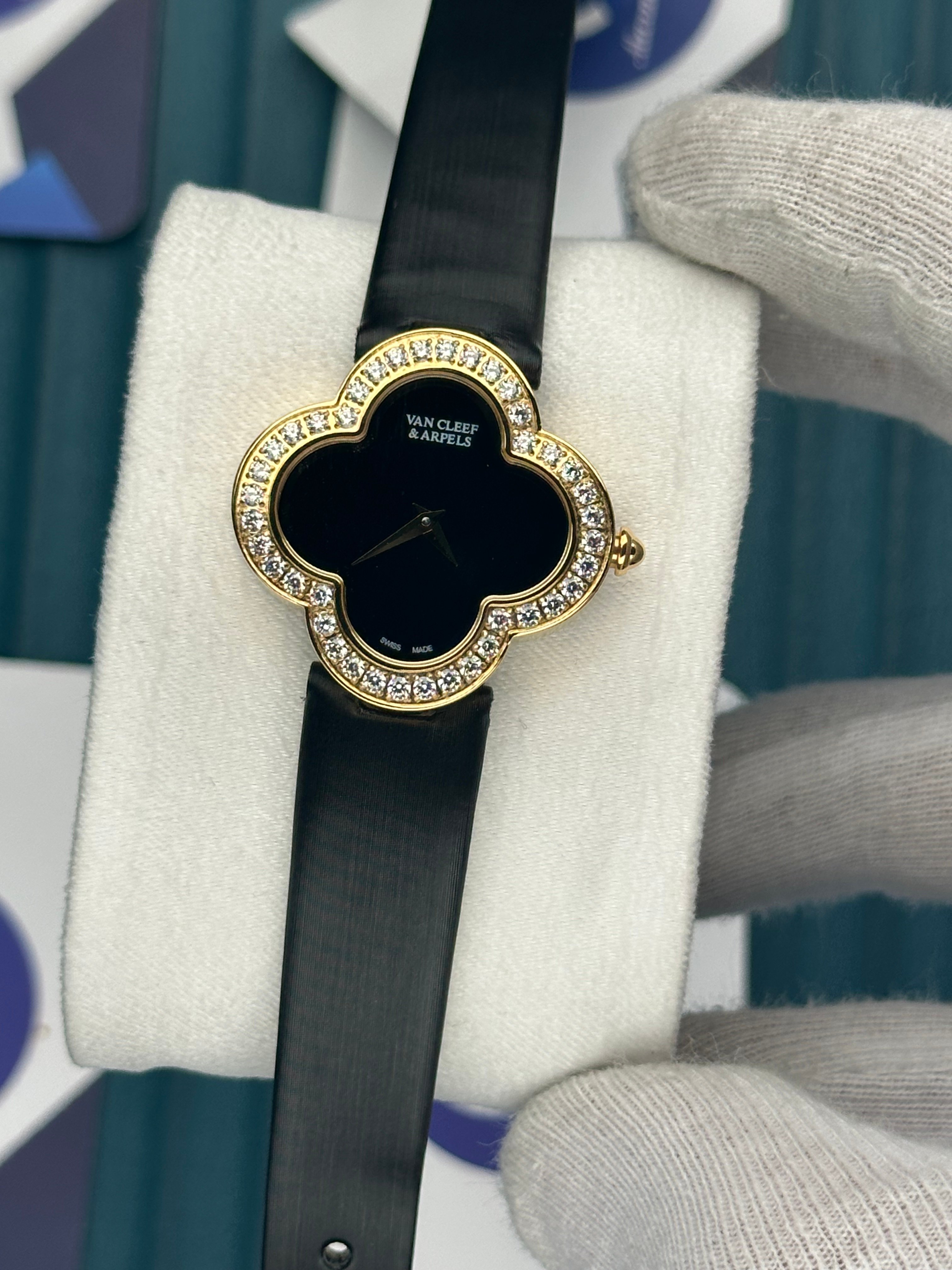 VAN CLEEF & ARPELS BLACK DIAL DIAMOND BEZEL GOLD CASE BLACK LEATHER CORD