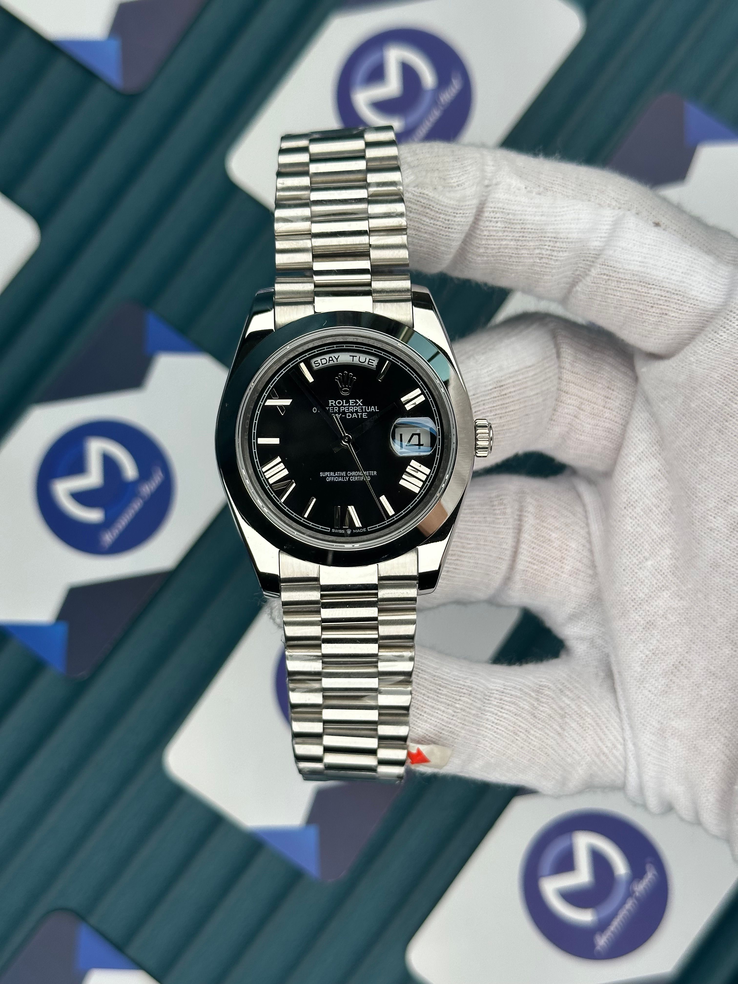 ROLEX DAY-DATE BLACK DIAL OVAL BEZEL ROMA INDEX SILVER PRESIDENT