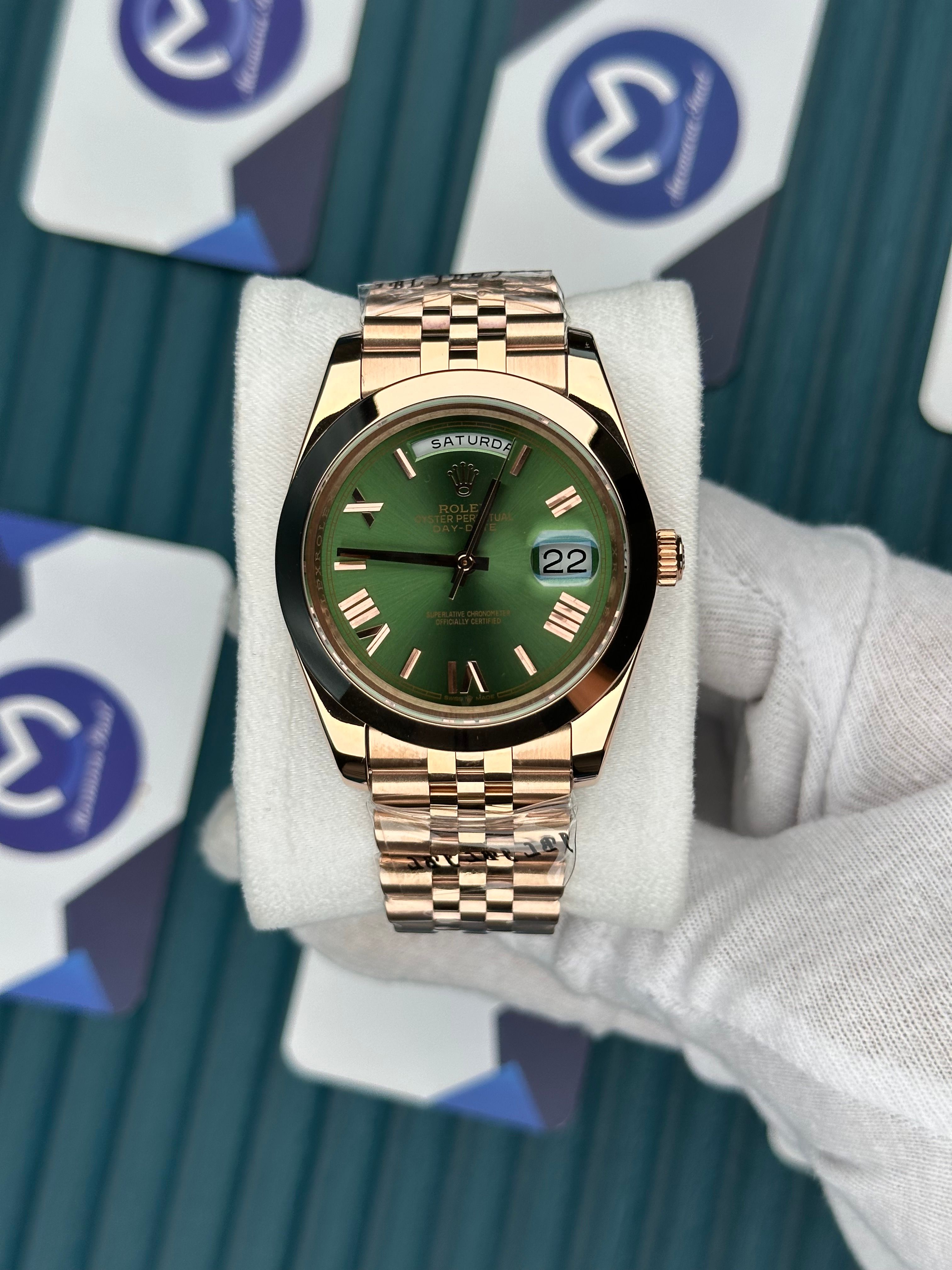 ROLEX DAY-DATE GREEN DIAL OVAL BEZEL ROSE ROMA INDEX ROSE JUBILE