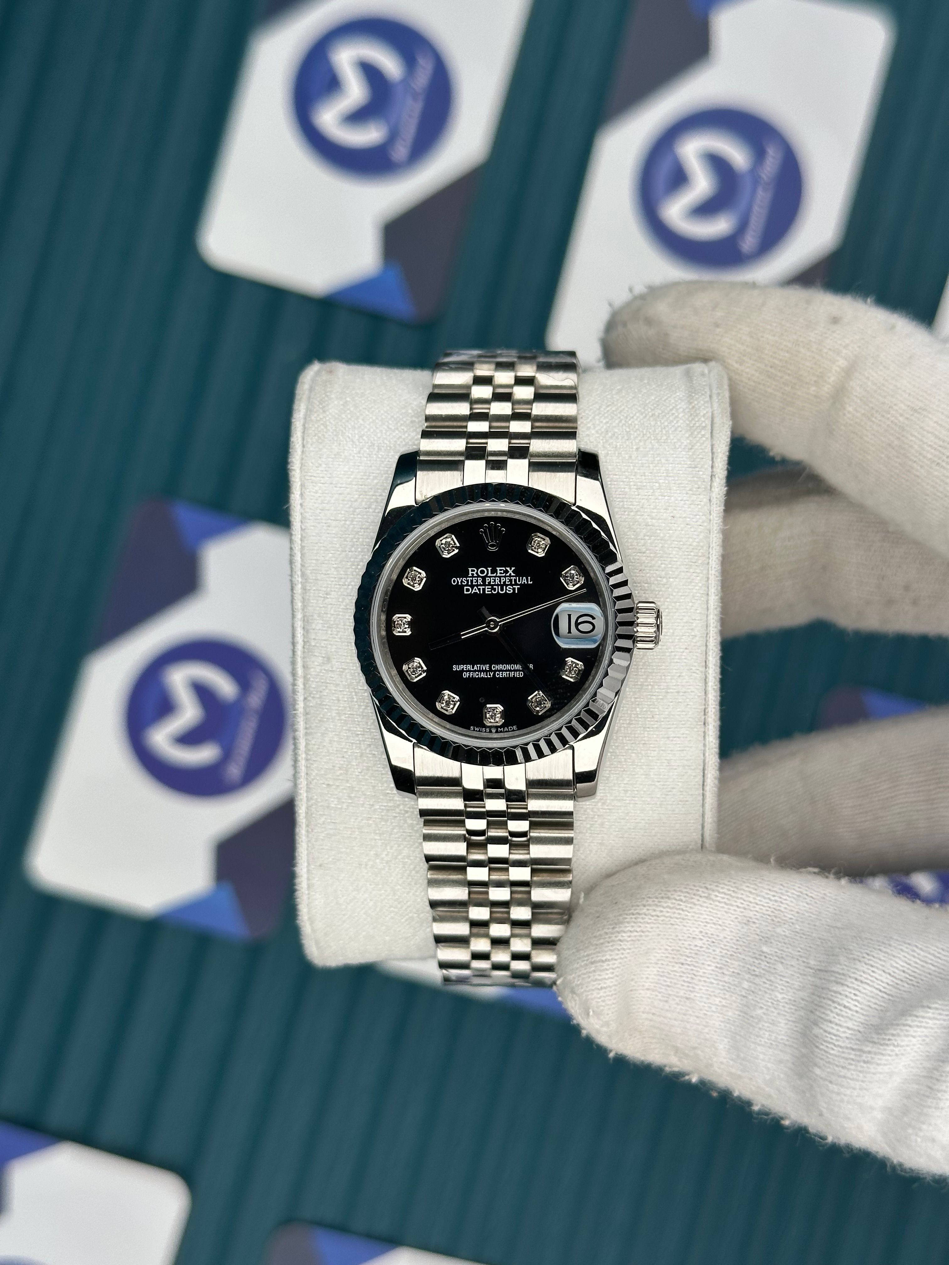 ROLEX 31 BLACK DIAL DIAMOND INDEX SILVER JUBILEE