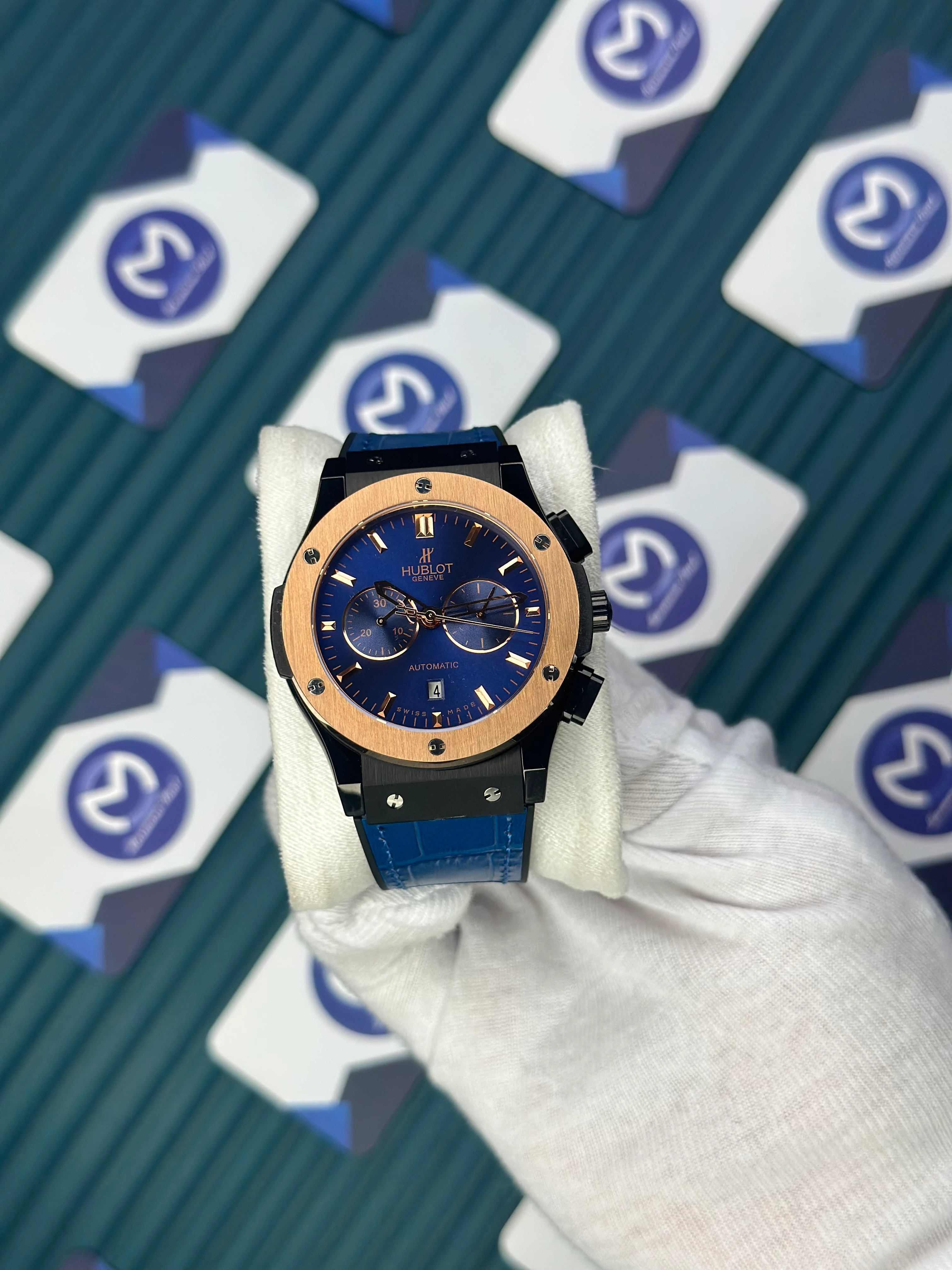 HUBLOT AUTOMATIC NAVY BLUE CHRONOGRAPH ROSE CASE BLACK CASE BLUE LEATHER CORD 