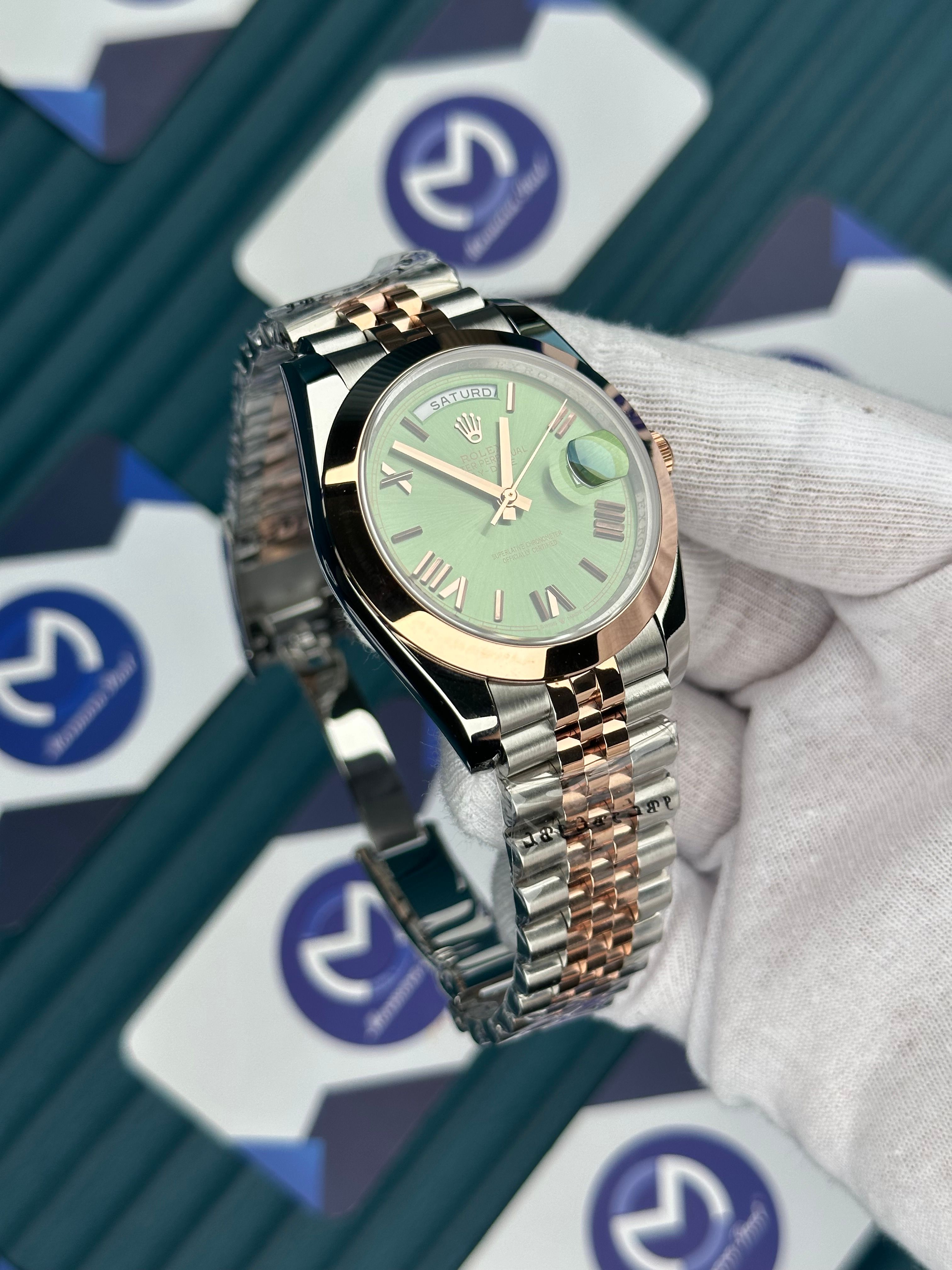 ROLEX DAY-DATE GREEN DIAL ROMA INDEX OVAL BEZEL ROSE-SILVER JUBILE