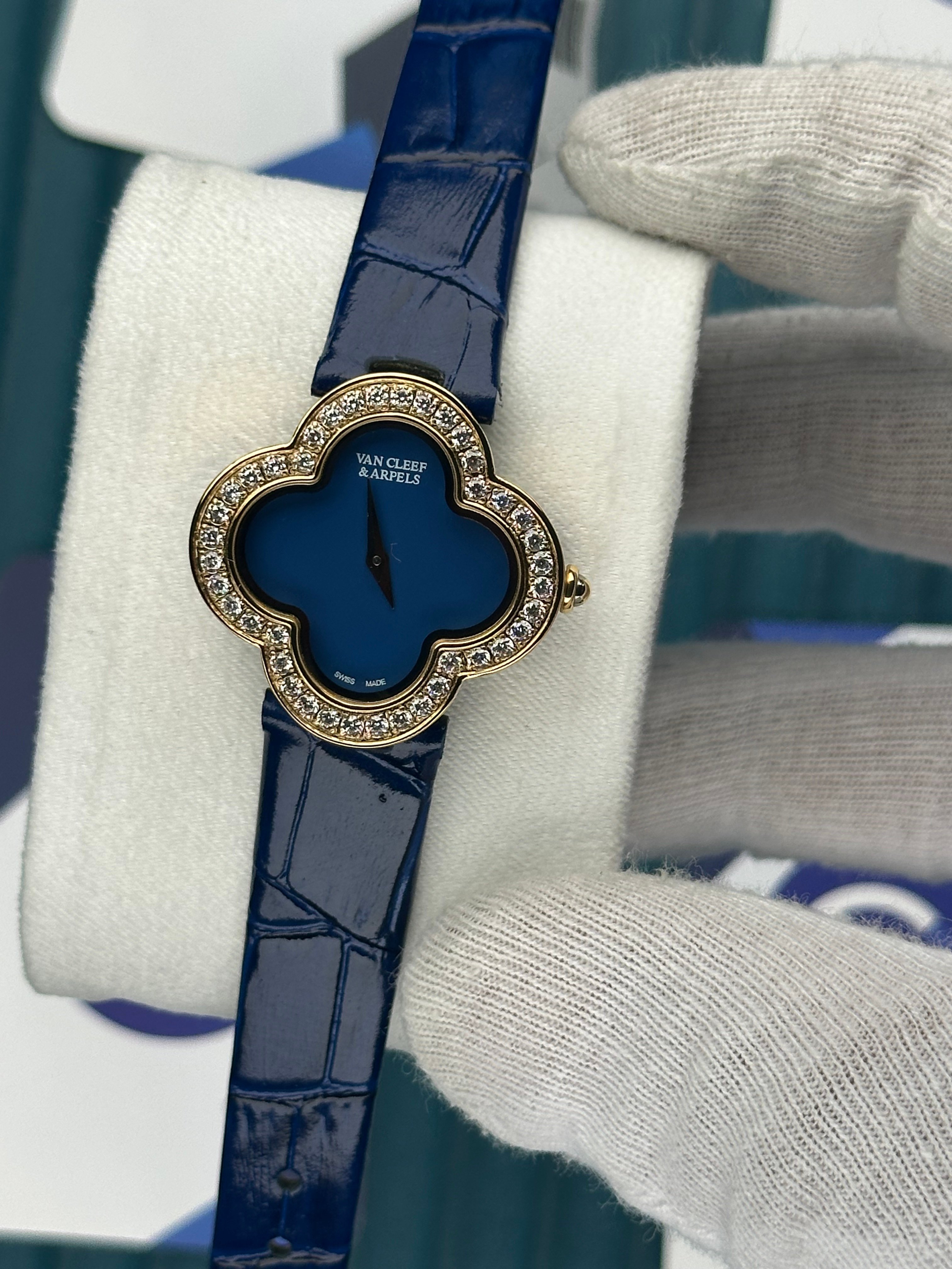 VAN CLEEF & ARPELS BLUE DIAL DIAMOND BEZEL GOLD CASE BLUE LEATHER CORD