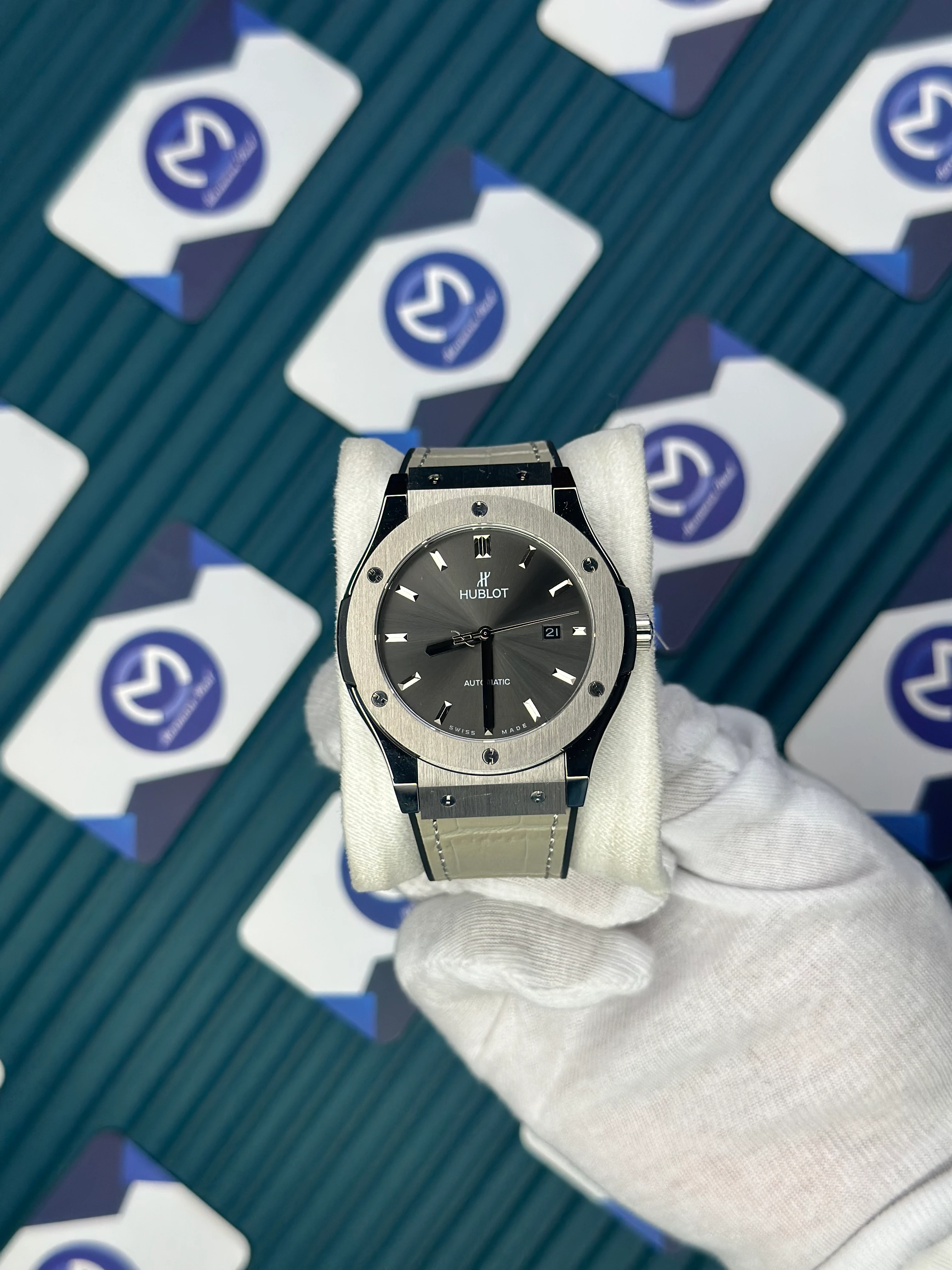 HUBLOT GENEVE AUTOMATIC NAVY GREY DIAL AND CASE GREY LEATHER CORD 