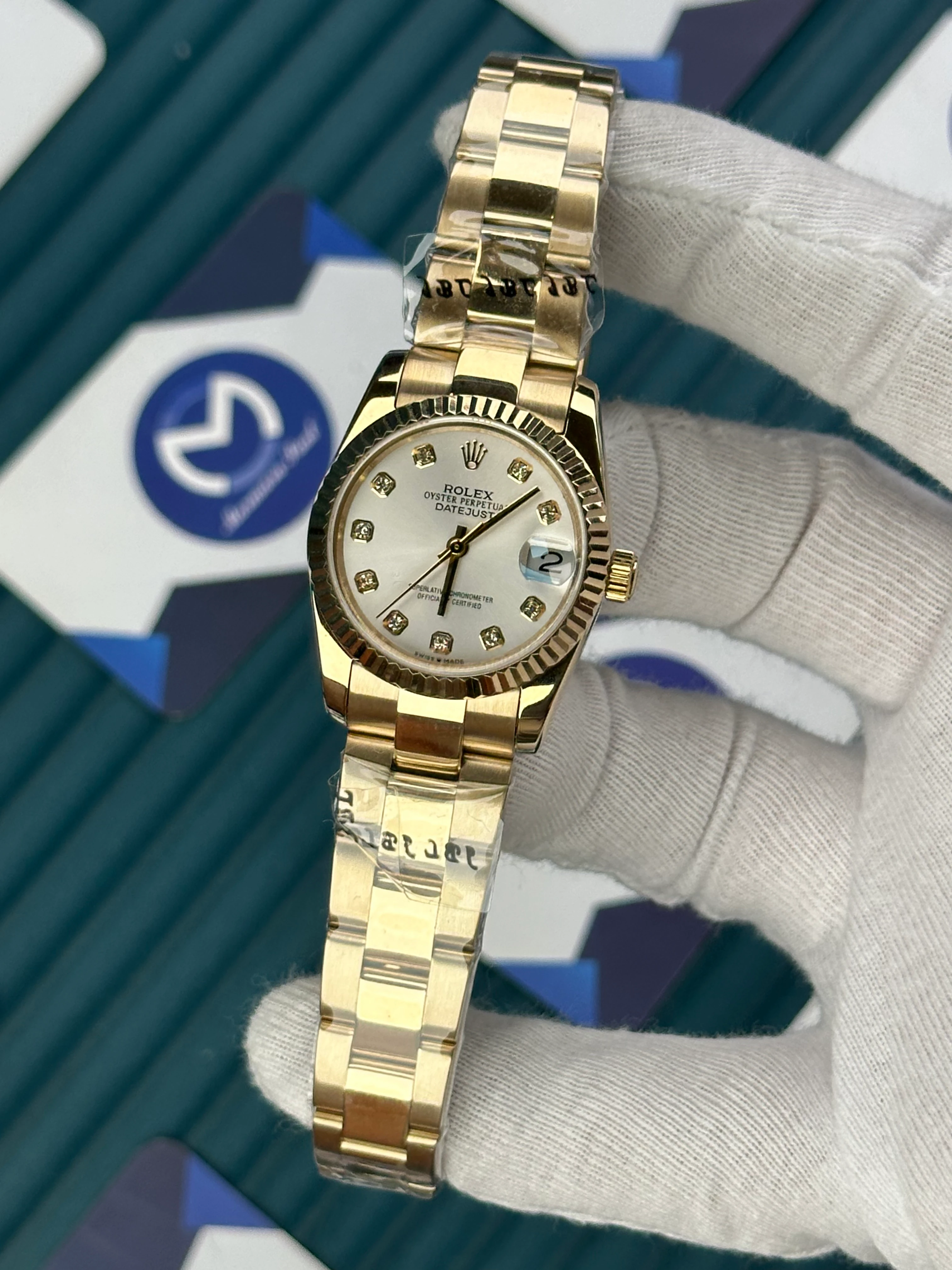 ROLEX 31 MM DATEJUST WHITE DIAL DIAMOND INDEX GOLD OYSTER 