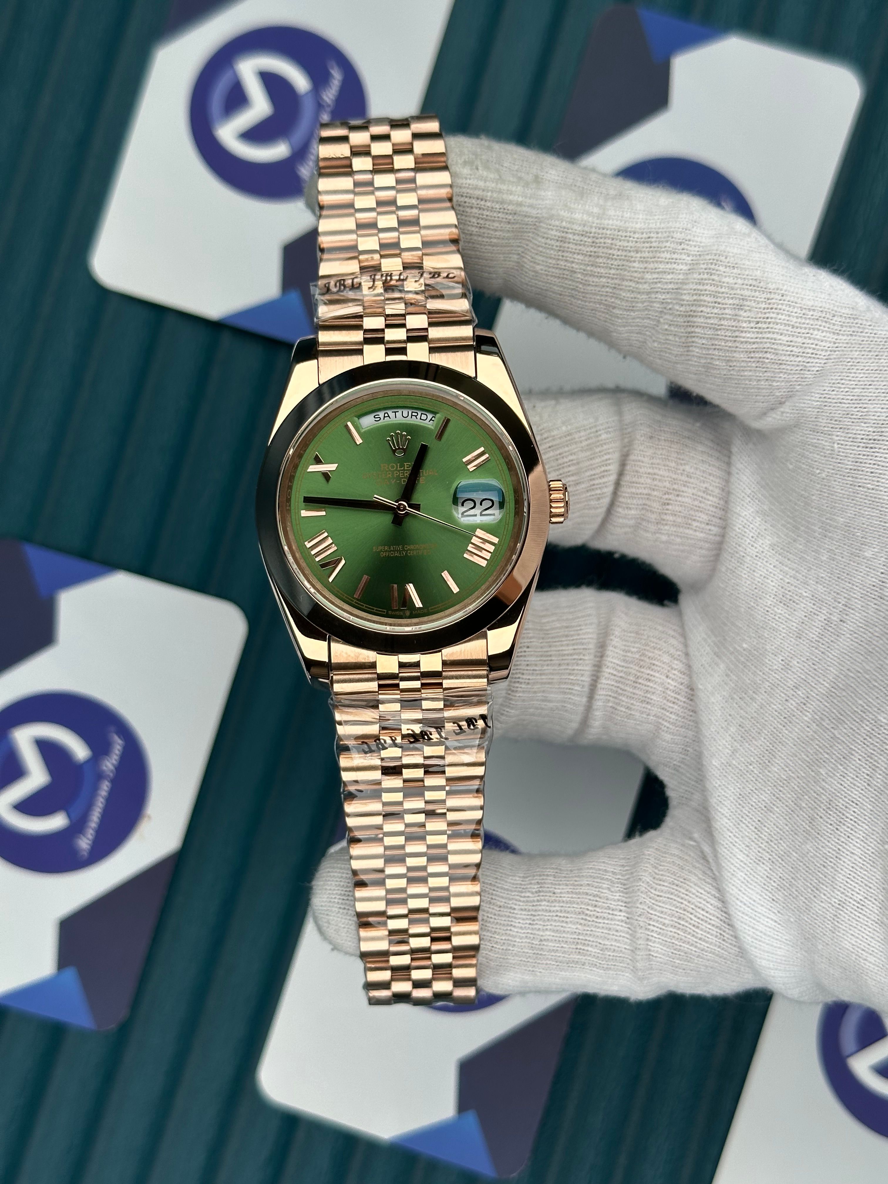 ROLEX DAY-DATE GREEN DIAL OVAL BEZEL ROSE ROMA INDEX ROSE JUBILE