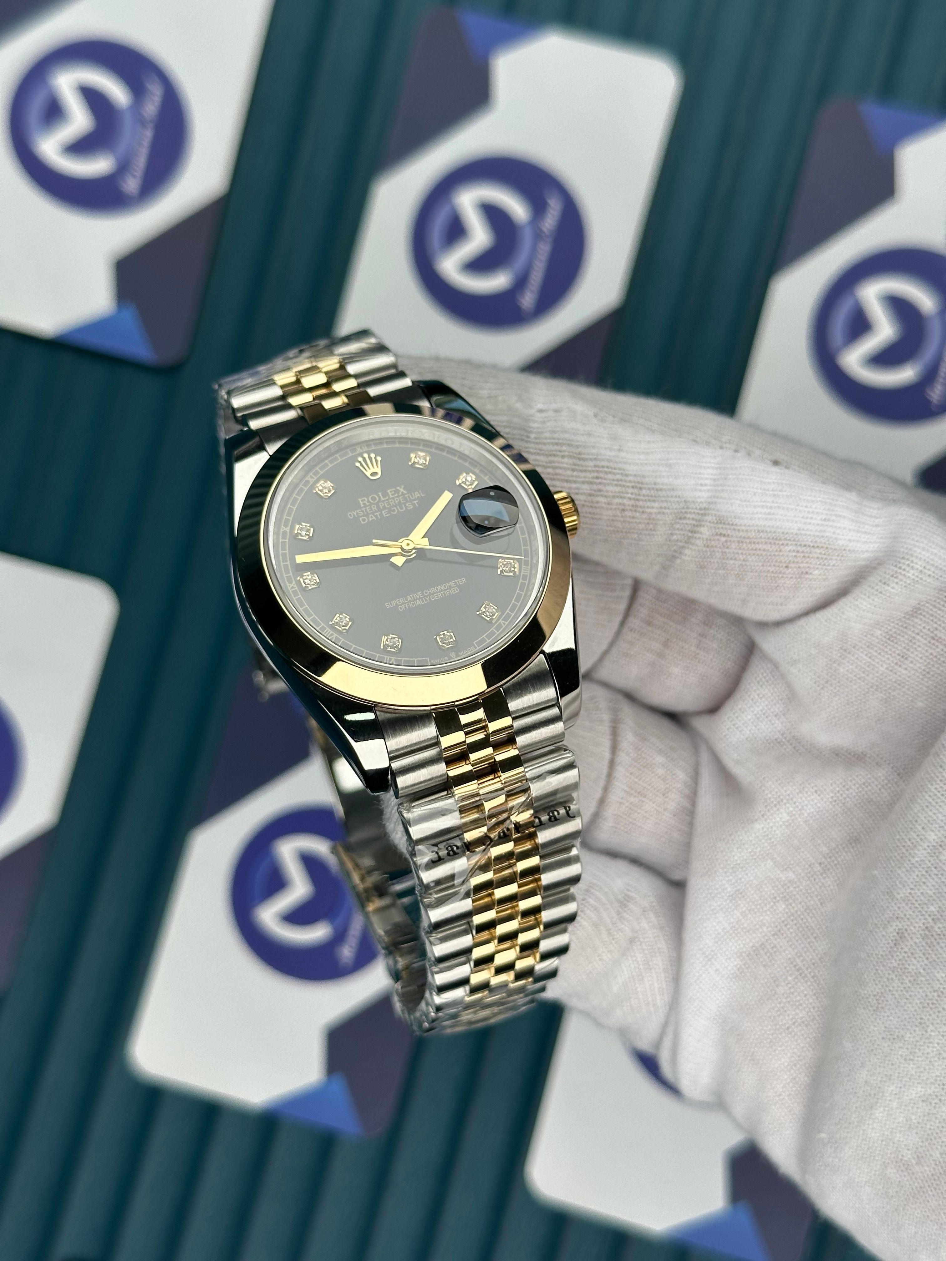 ROLEX DATEJUST OVAL BEZEL BLACK DIAL DIAMOND INDEX GOLD-JUBILE
