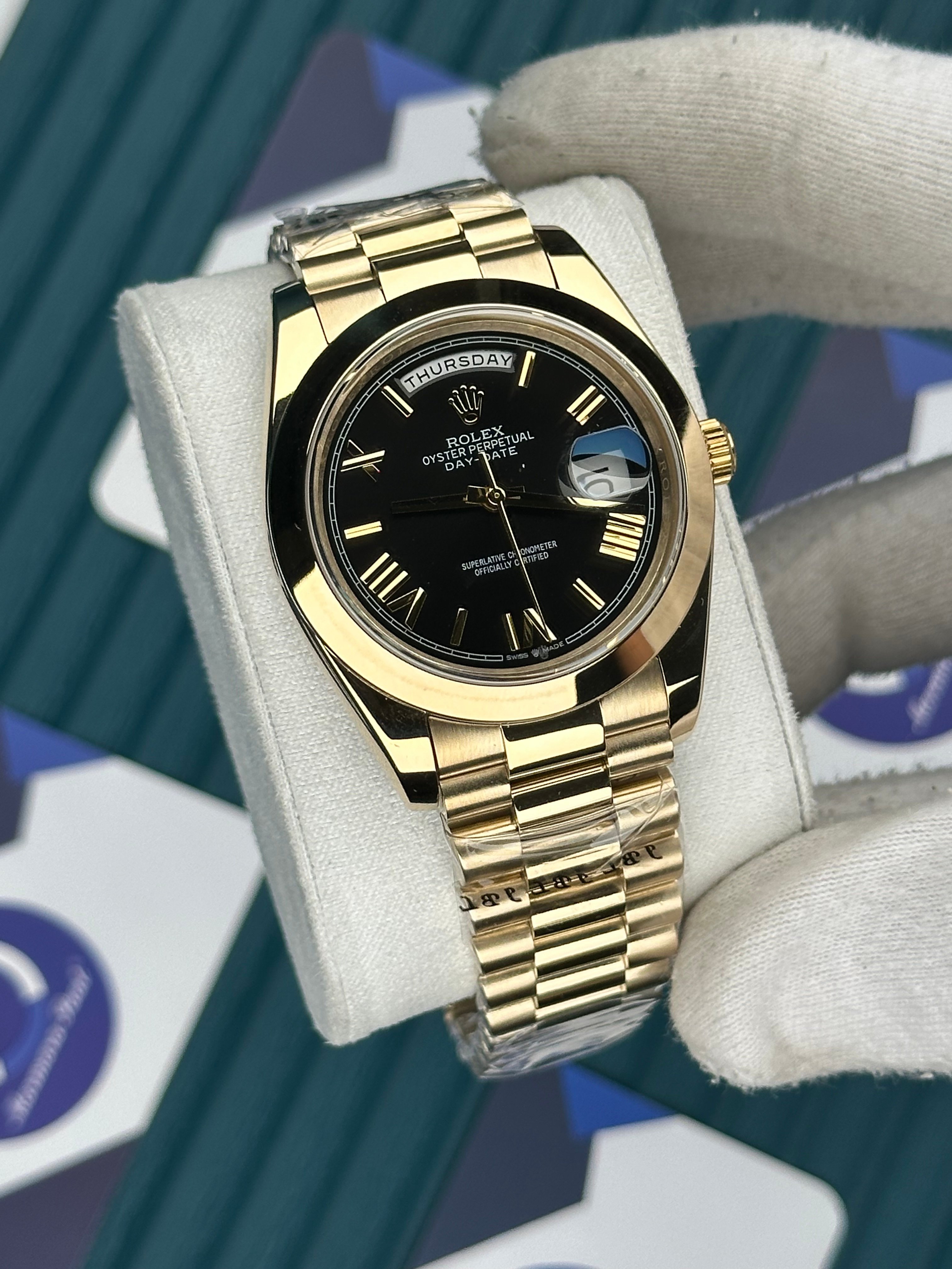 ROLEX DAY-DATE BLACK OVAL BEZEL ROMA INDEX GOLD PRESIDENT