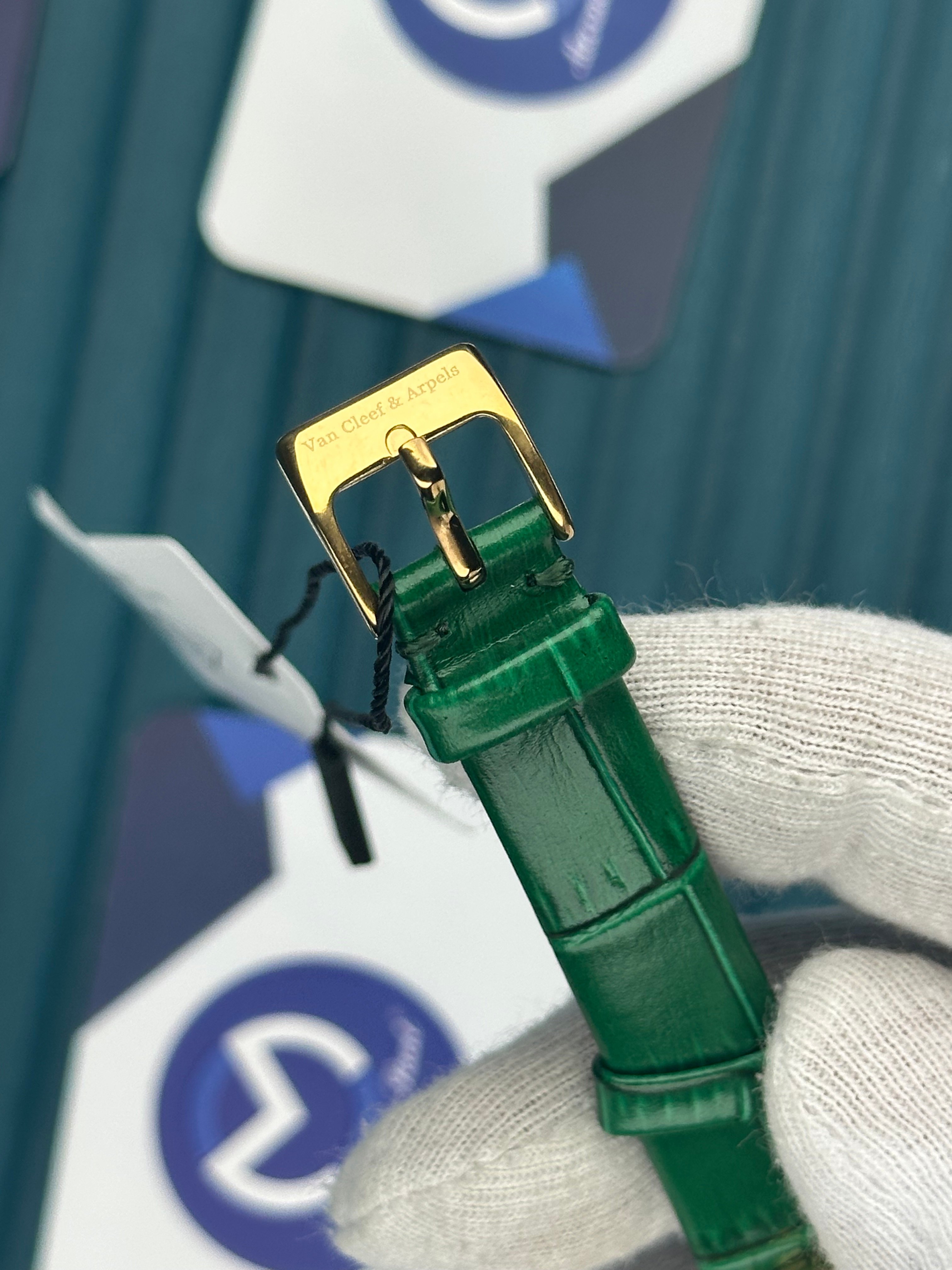 VAN CLEEF & ARPELS WHITE DIAL DIAMOND BEZEL GOLD CASE GREEN LEATHER CORD