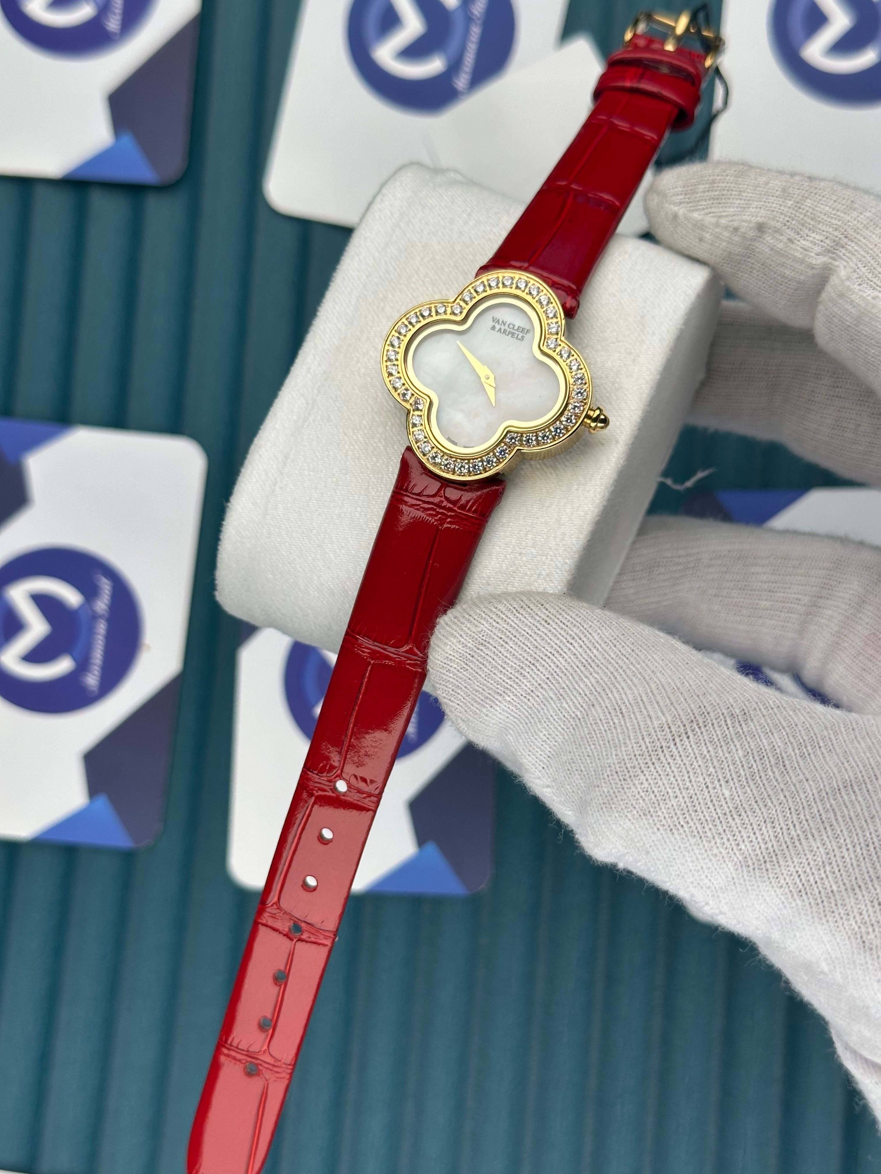 VAN CLEEF & ARPELS WHITE DIAL DIAMOND BEZEL GOLD CASE RED LEATHER CORD