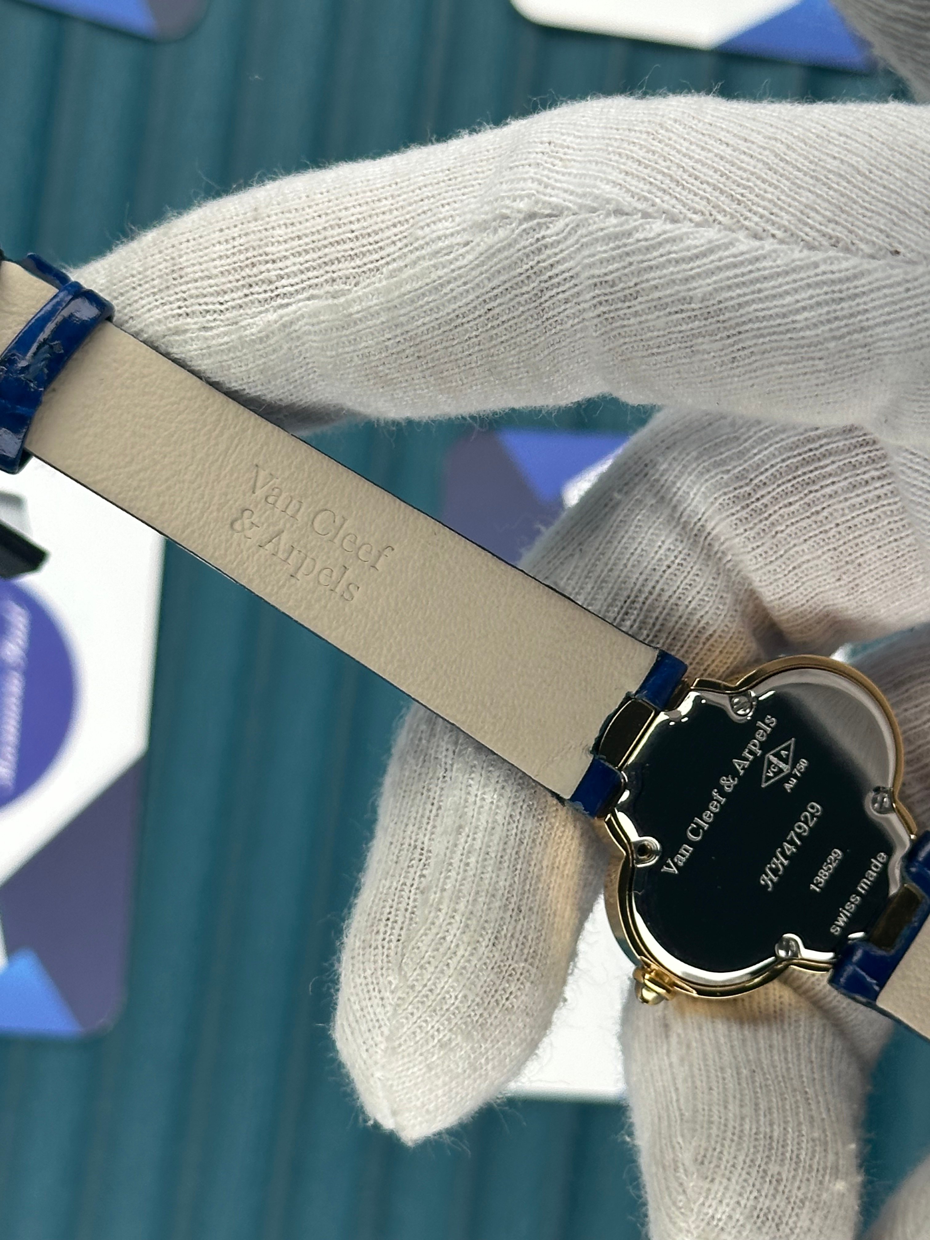 VAN CLEEF & ARPELS BLUE DIAL DIAMOND BEZEL GOLD CASE BLUE LEATHER CORD