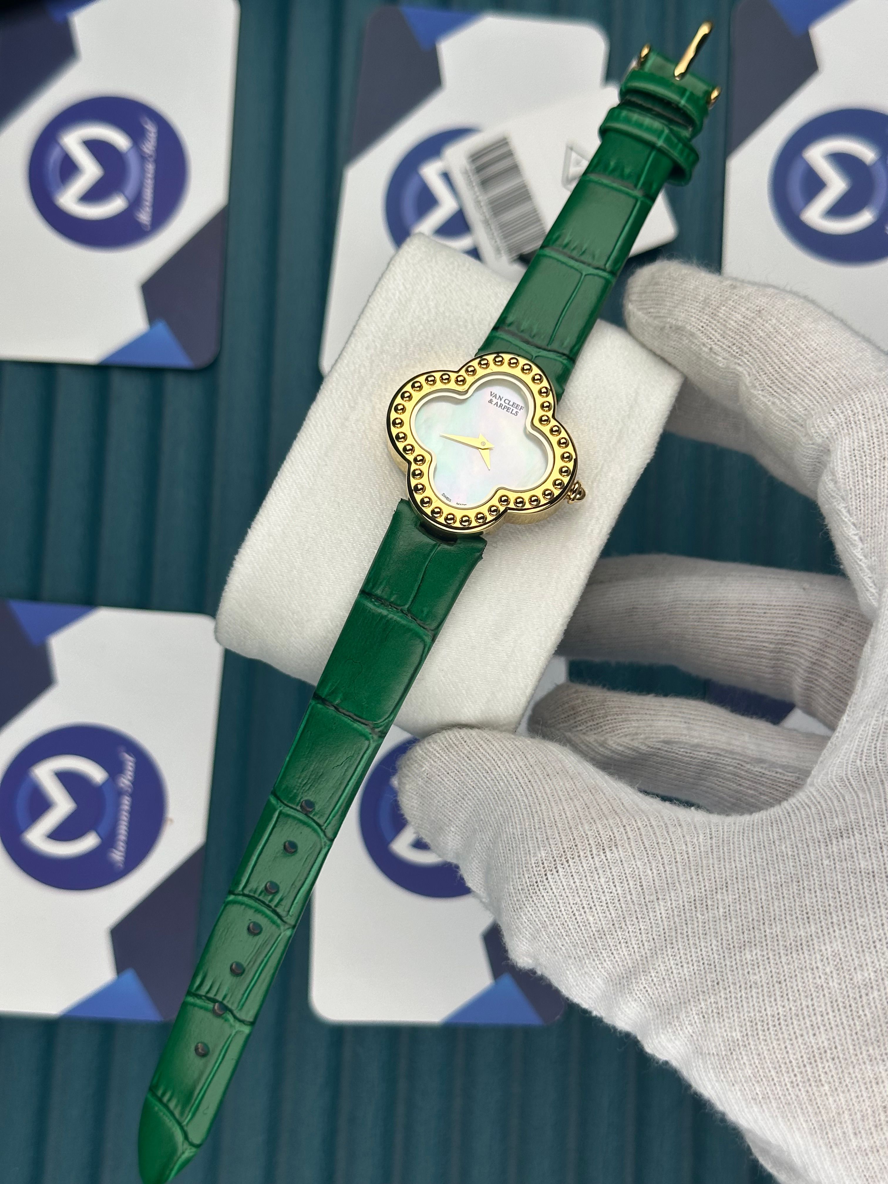 VAN CLEEF & ARPELS WHITE DIAL DIAMOND BEZEL GOLD CASE GREEN LEATHER CORD