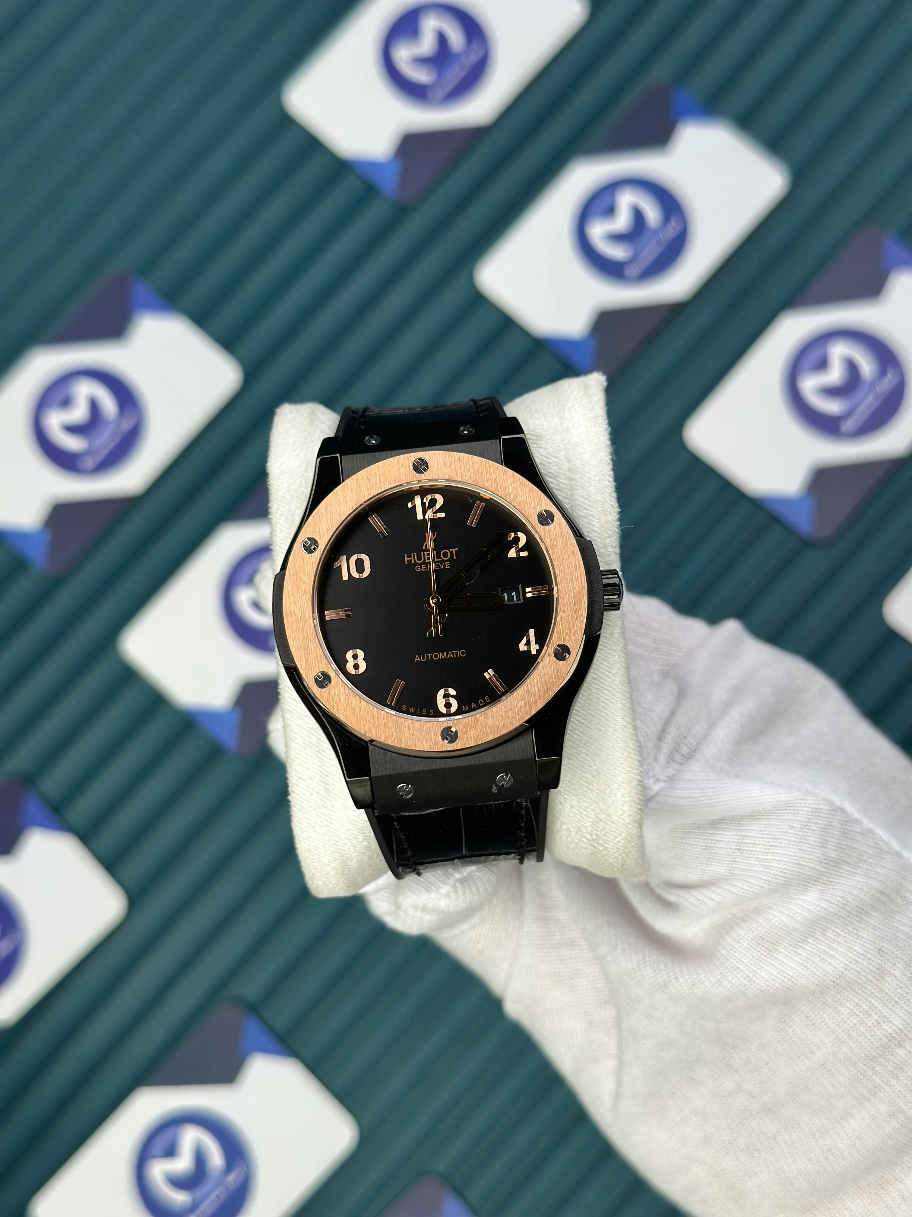 HUBLOT GENEVE AUTOMATIC VENDOME BLACK DIAL ROSE BEZEL BLACK CASE BLACK LEATHER CORD