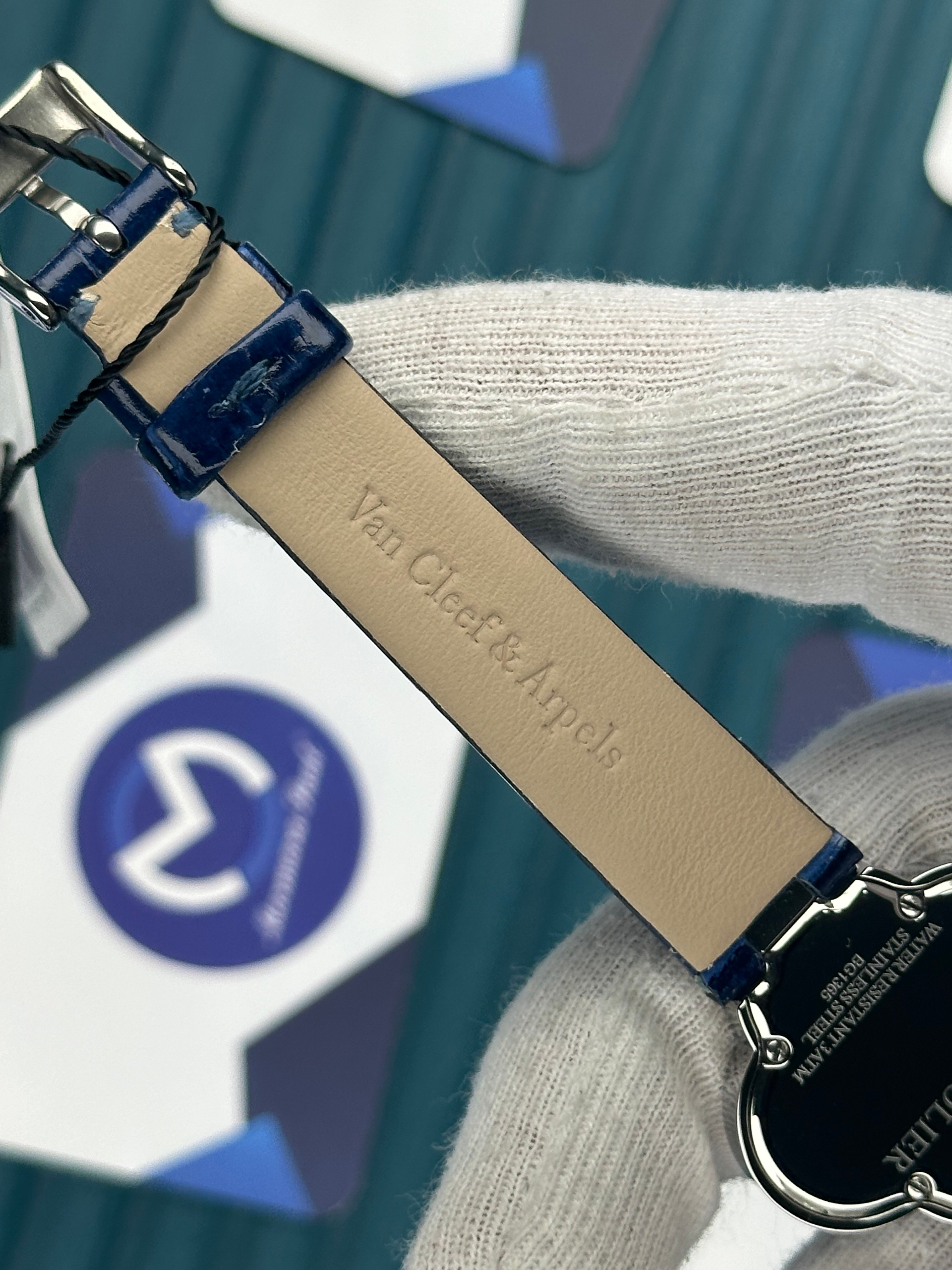 VAN CLEEF & ARPELS WHITE DIAL DIAMOND BEZEL SILVER CASE BLUE LEATHER CORD