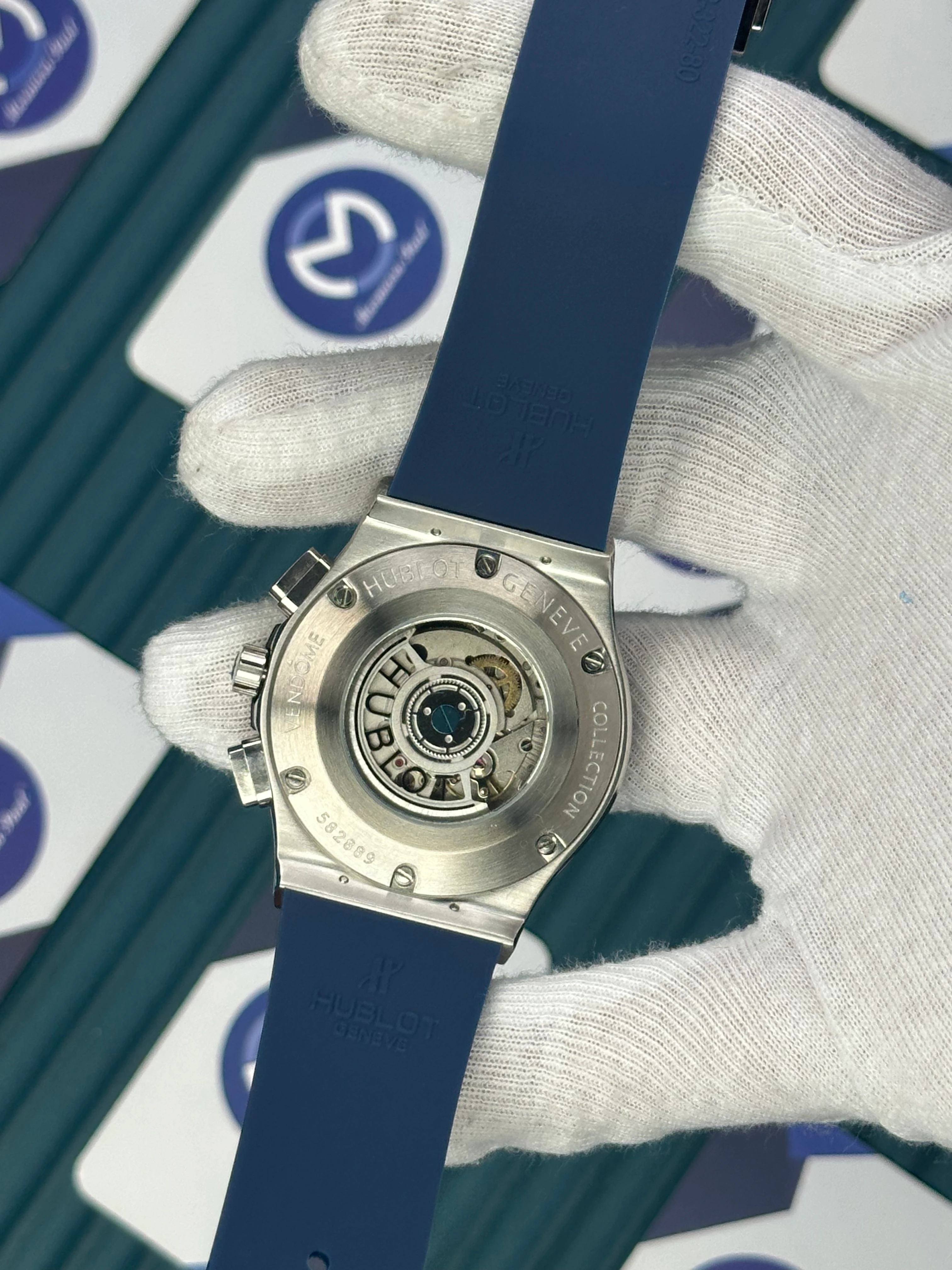 HUBLOT AUTOMATIC BLUE CHRONOGRAP BLACK BEZEL SILVER CASE BLUE RUBBER CORD 