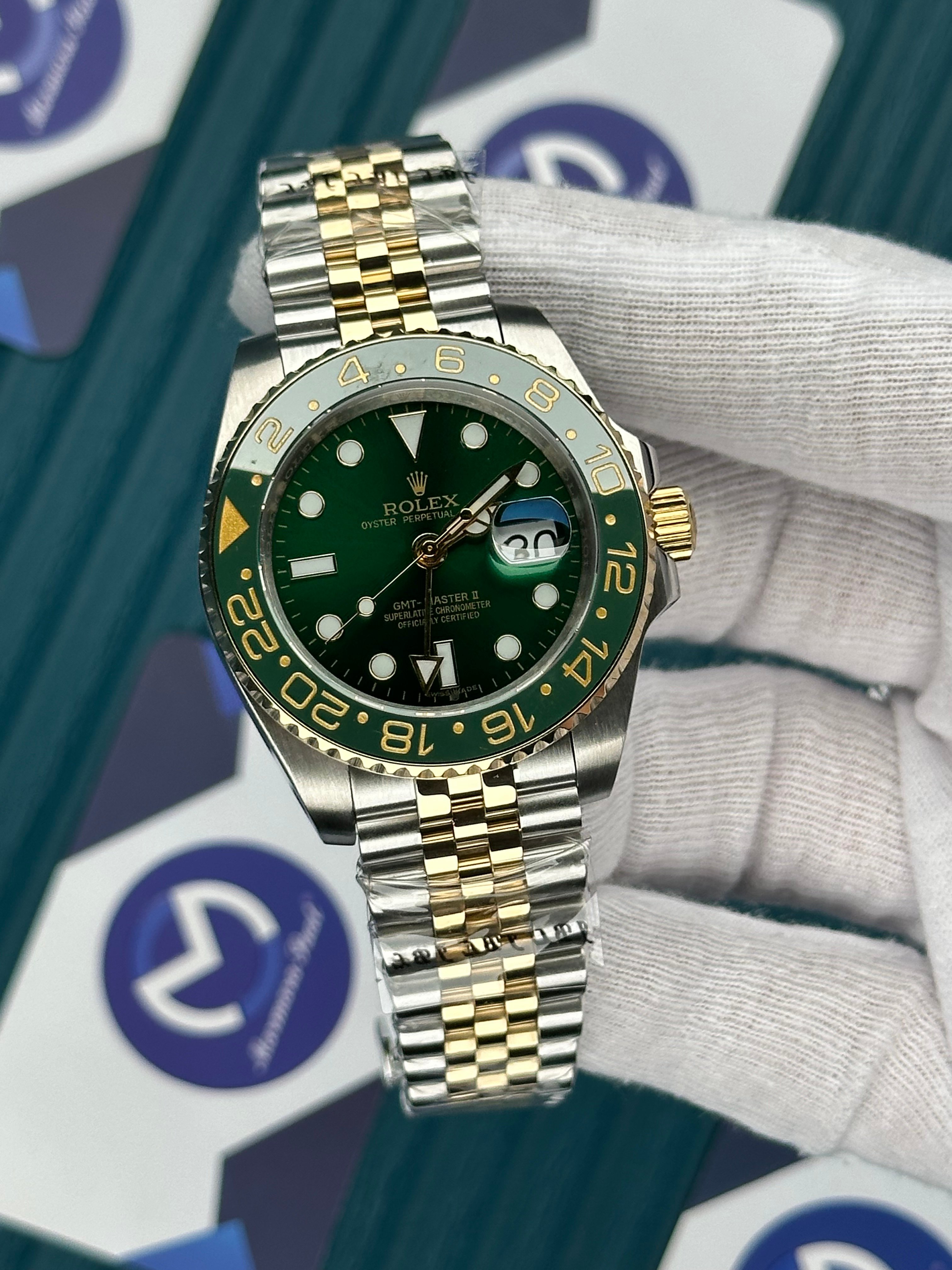 ROLEX GMT MASTER II GREEN DIAL AND BEZEL GOLD-SILVER JUBILE