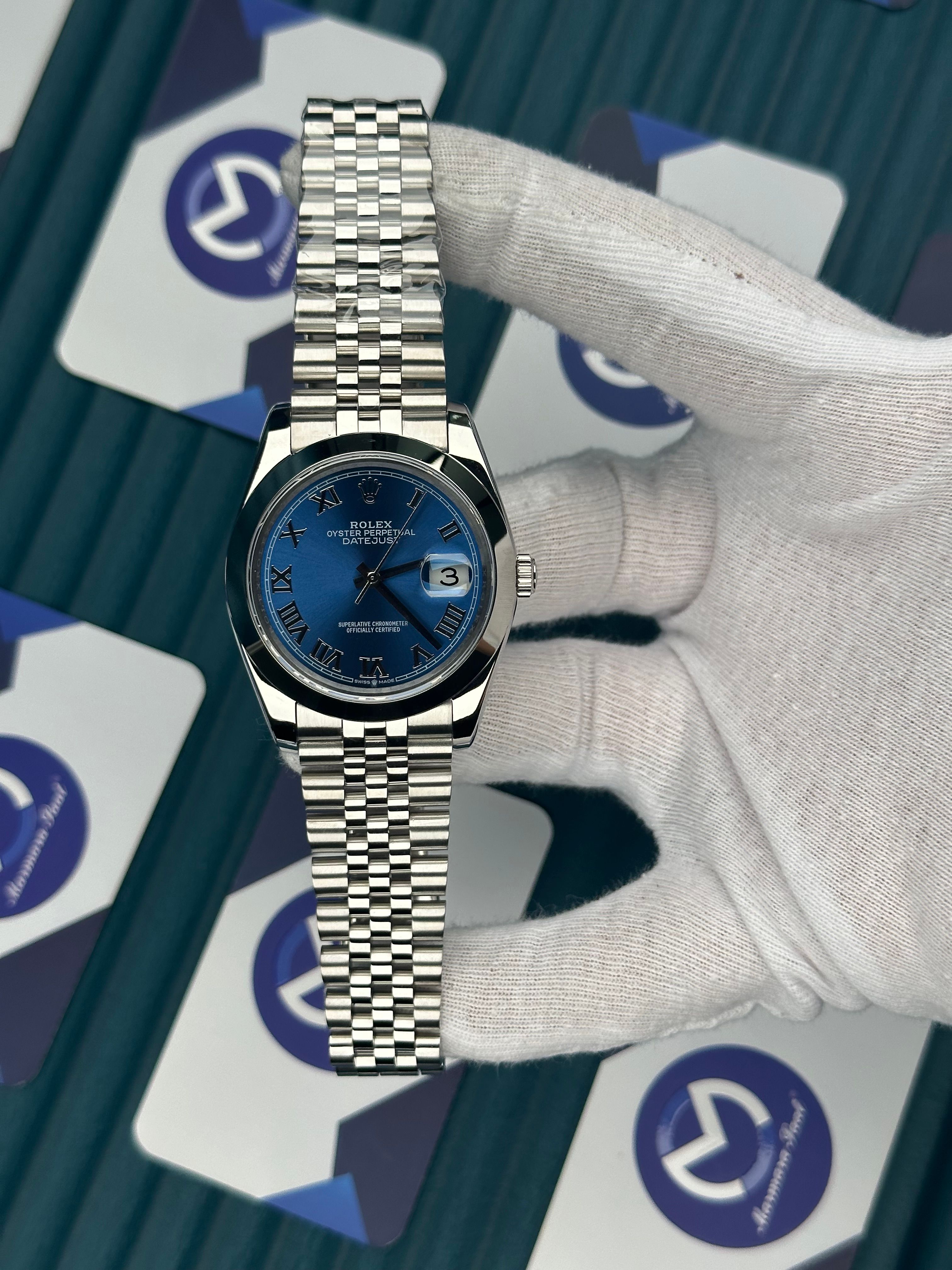ROLEX DATEJUST BLUE DIAL OVAL BEZEL SILVER ROMA INDEX SILVER JUBILE