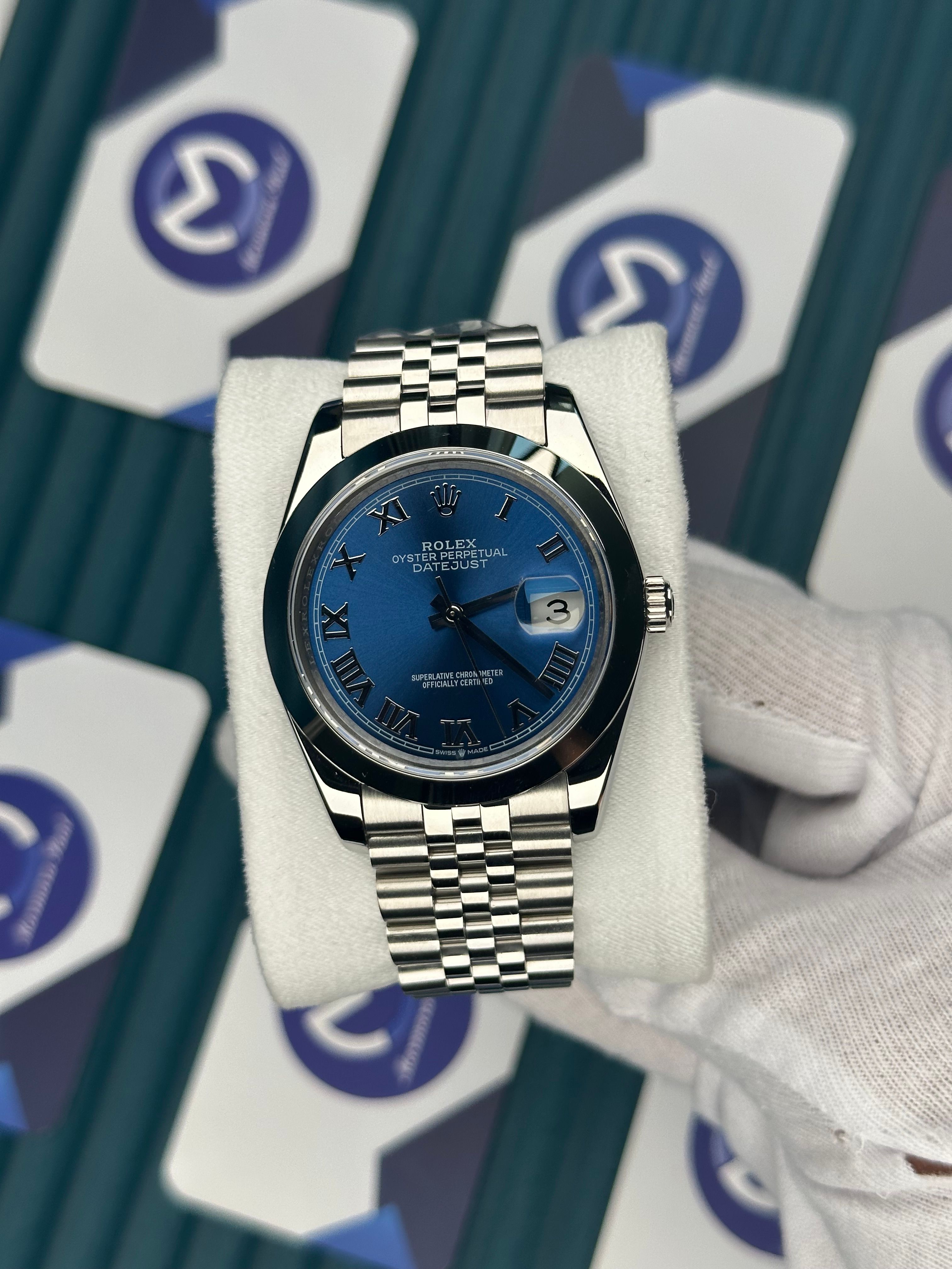 ROLEX DATEJUST BLUE DIAL OVAL BEZEL SILVER ROMA INDEX SILVER JUBILE