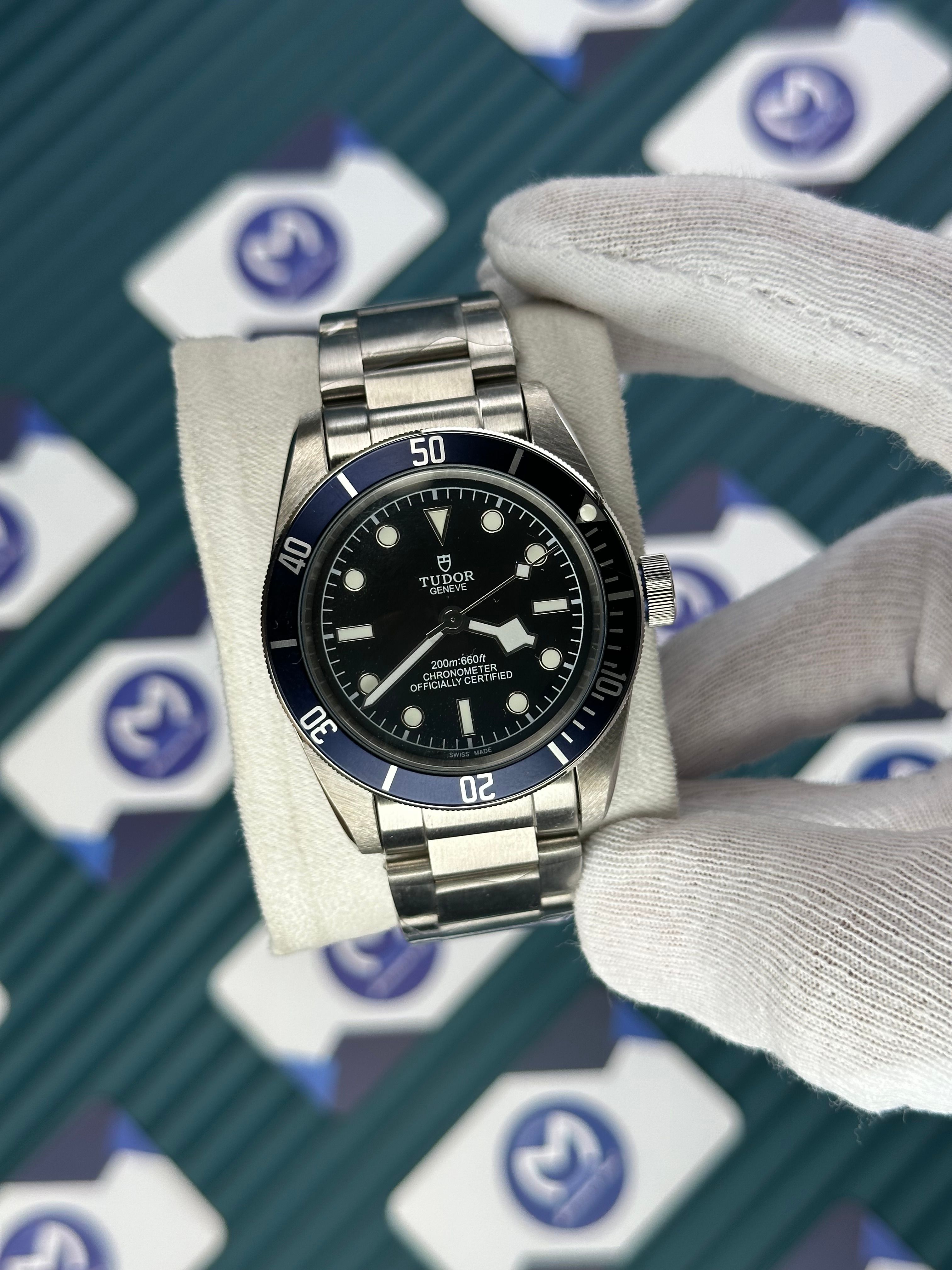 TUDOR BLACK DIAL BLUE BEZEL SILVER