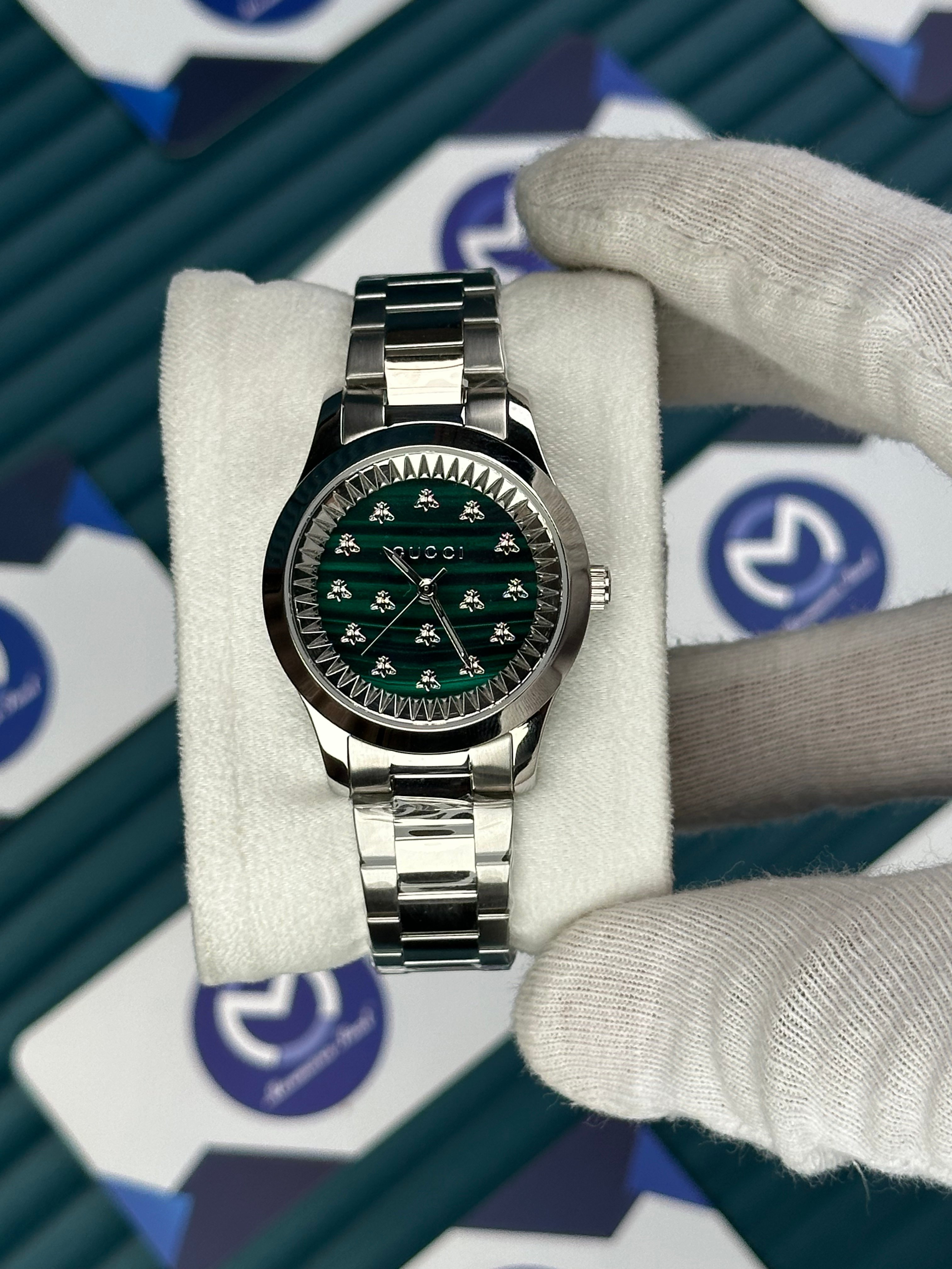 GUCCI WOMAN GREEN DIAL BUTTERFLY MOTIF SILVER