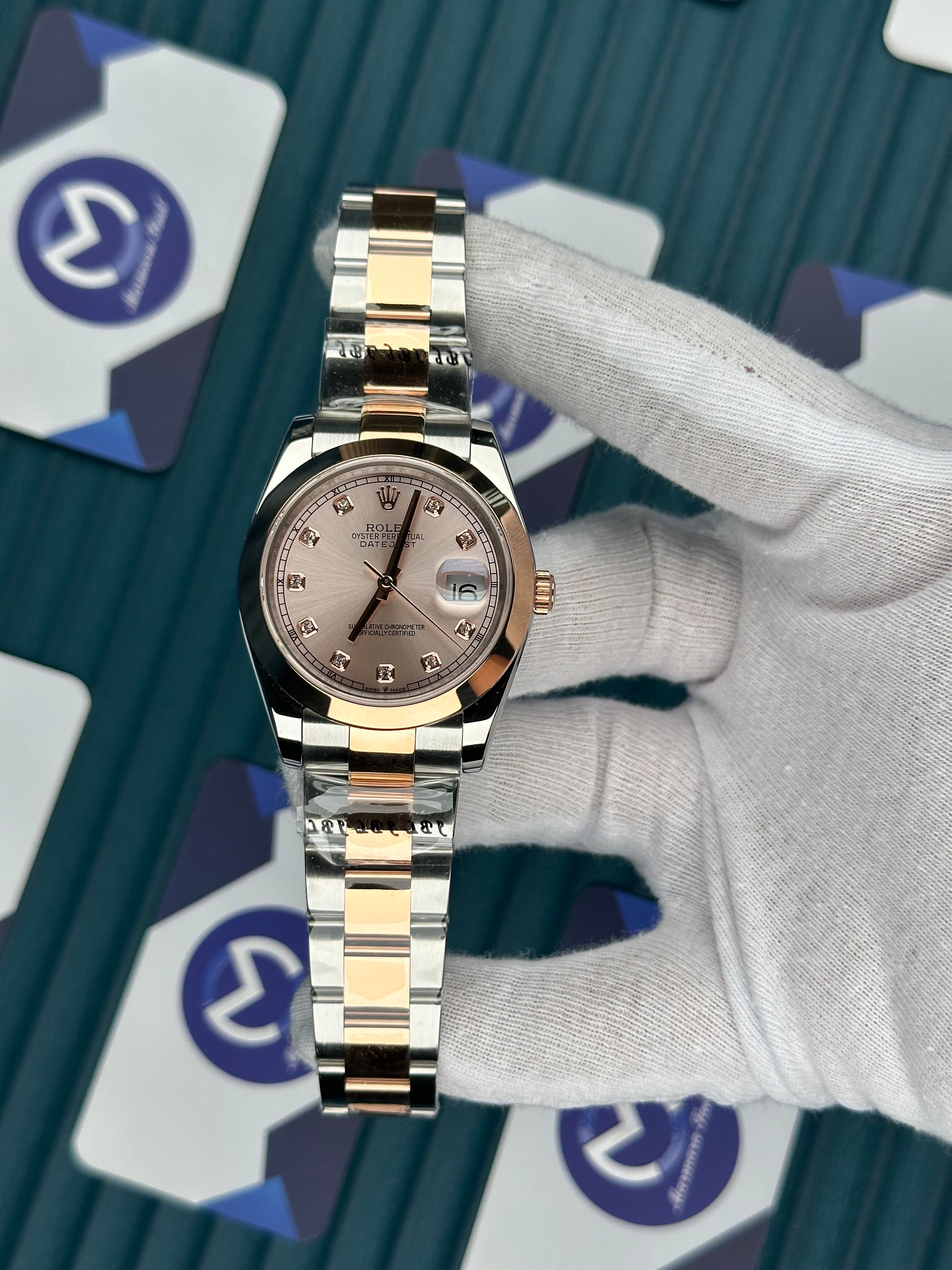 ROLEX DATEJUST CHAMPAGNE DIAL OVAL BEZEL ROSE-SILVER OYSTER